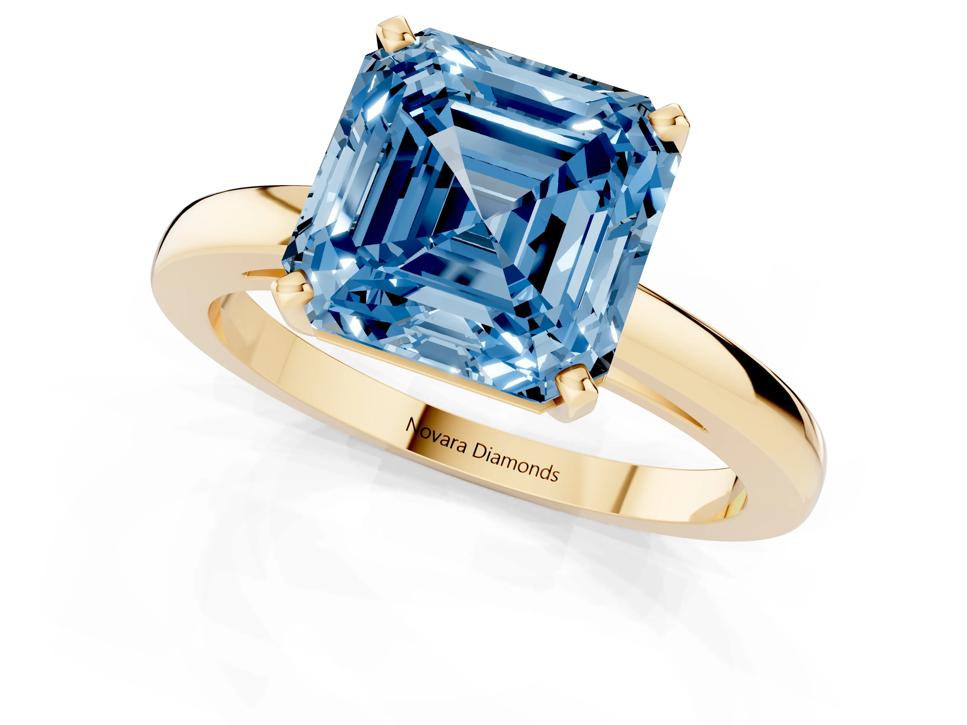 Fancy Blue Asscher Cut Diamond Solitaire Engagement Ring Set in Yellow gold with Prong Setting on a Classic Band