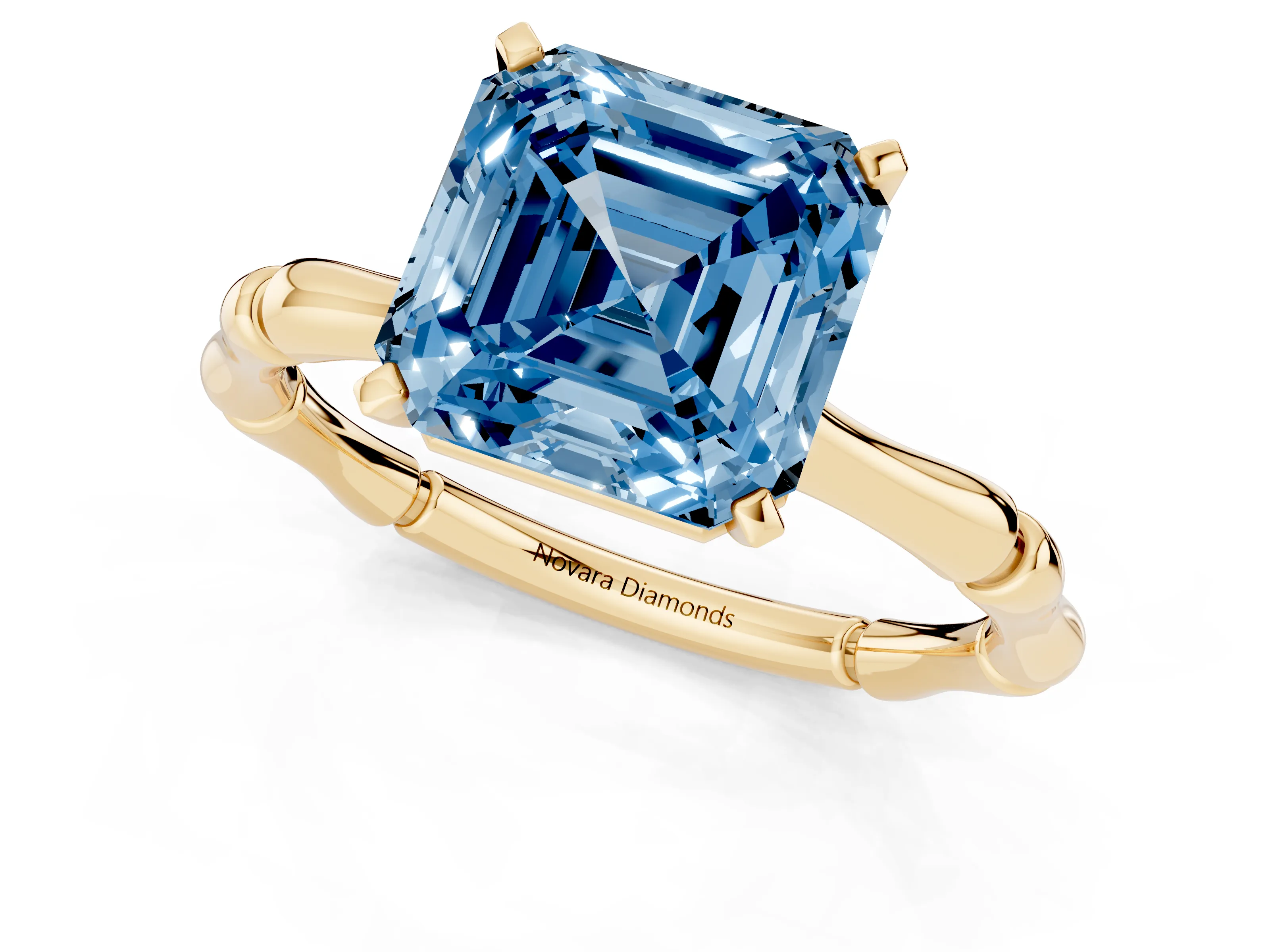 Fancy Blue Asscher Cut Diamond Solitaire Ring Set in Yellow gold with Bamboo Band and Prong Setting