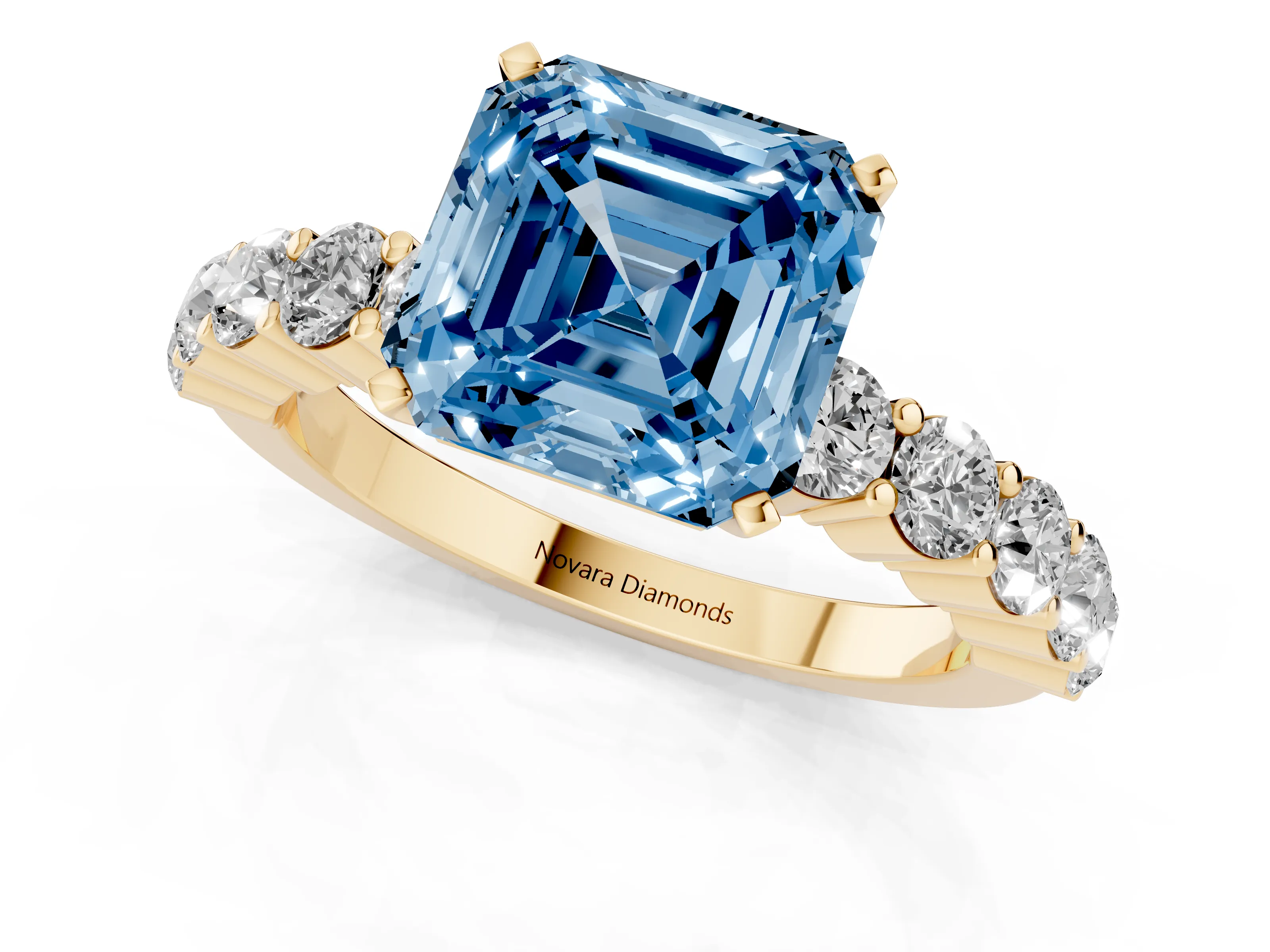 Fancy Blue Asscher Cut Diamond Solitaire Ring Set in Yellow gold with Shared Prong Round Side Stones