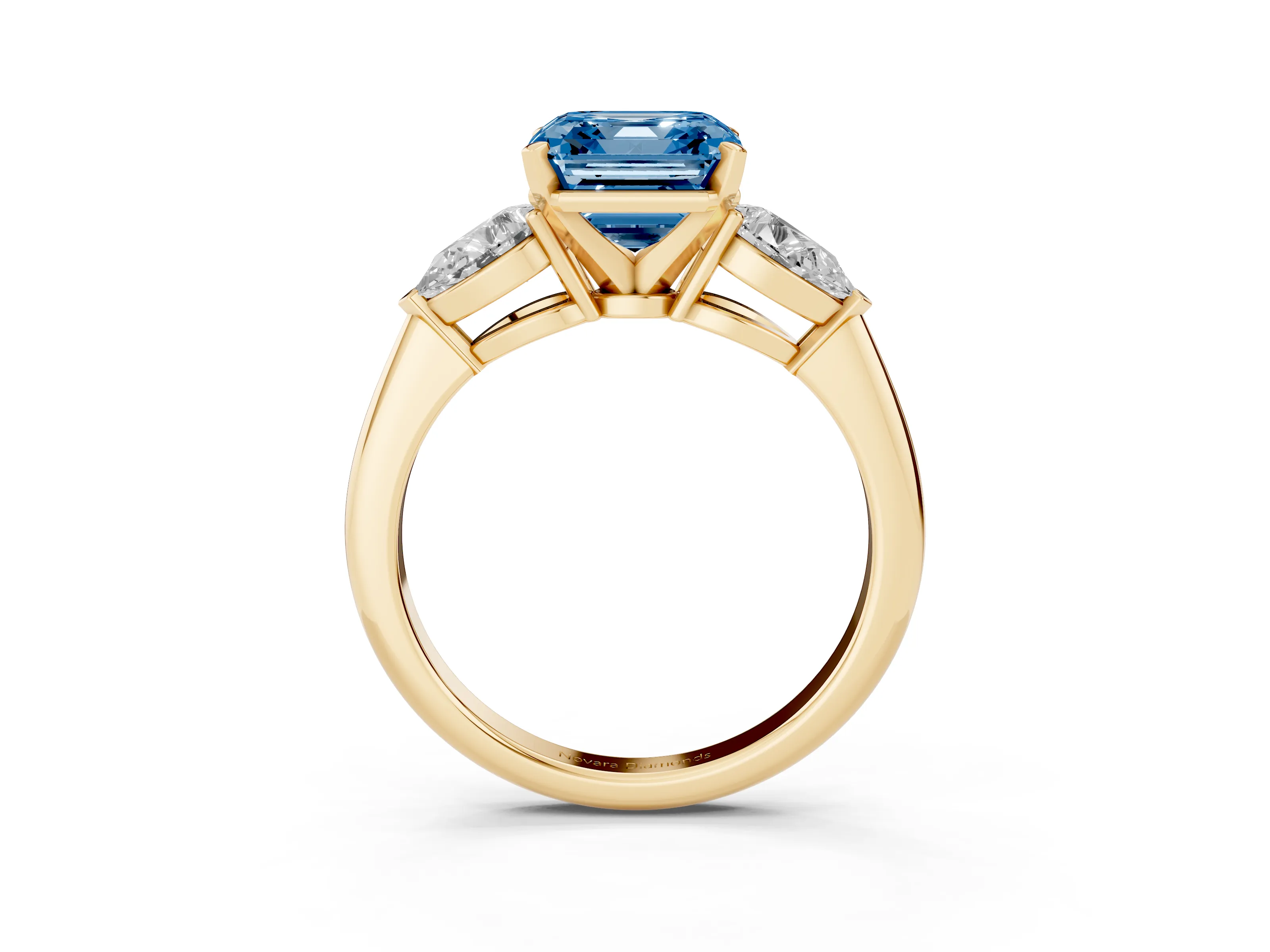 Fancy Blue Three-Stone Asscher Cut Diamond Ring Set in Yellow gold with Pear Side Stones and Prong Setting