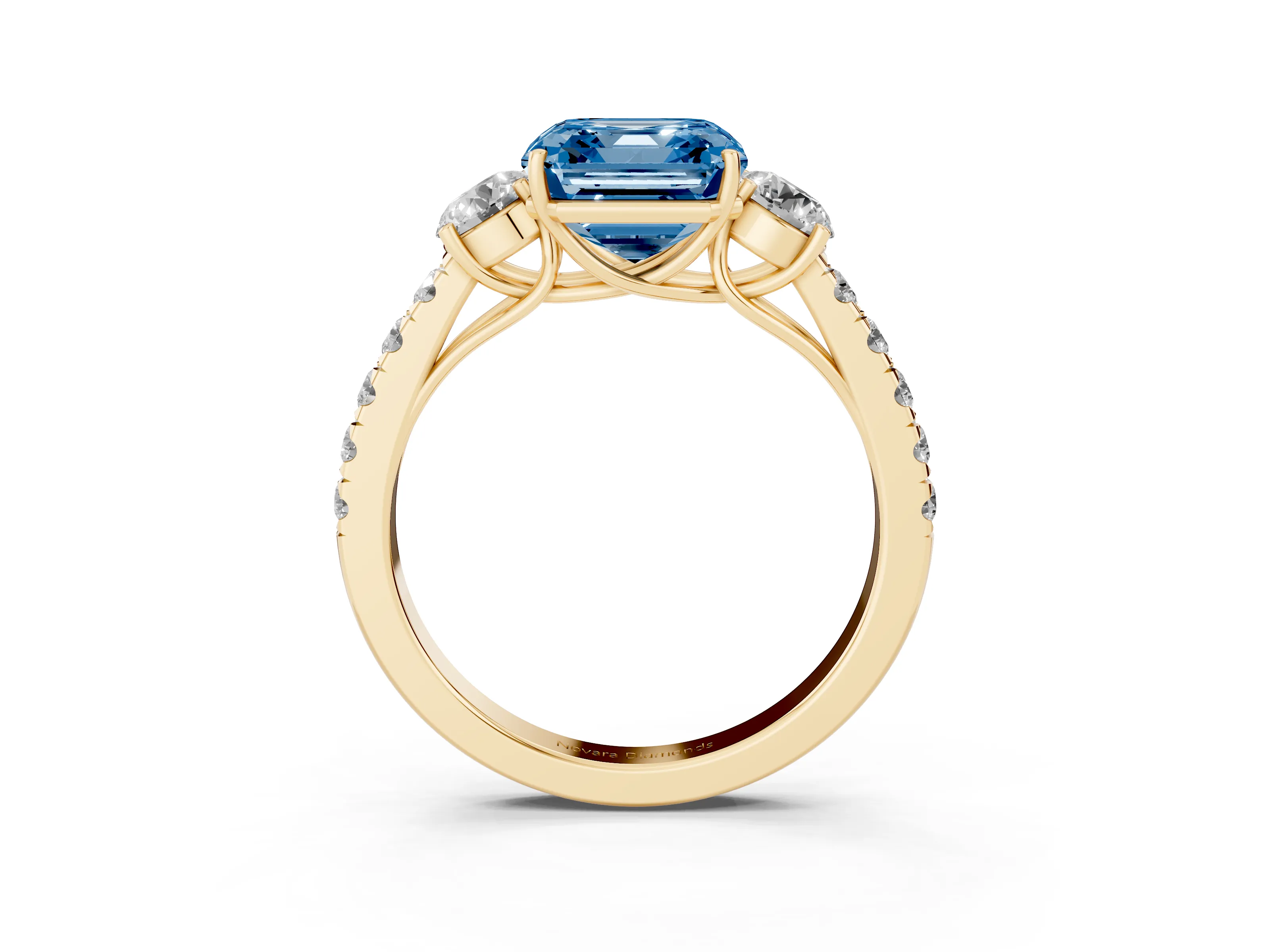 Fancy Blue Asscher Cut Diamond Three-Stone Ring Set in Yellow gold with Round Side Stones and Delicate Pavé Band
