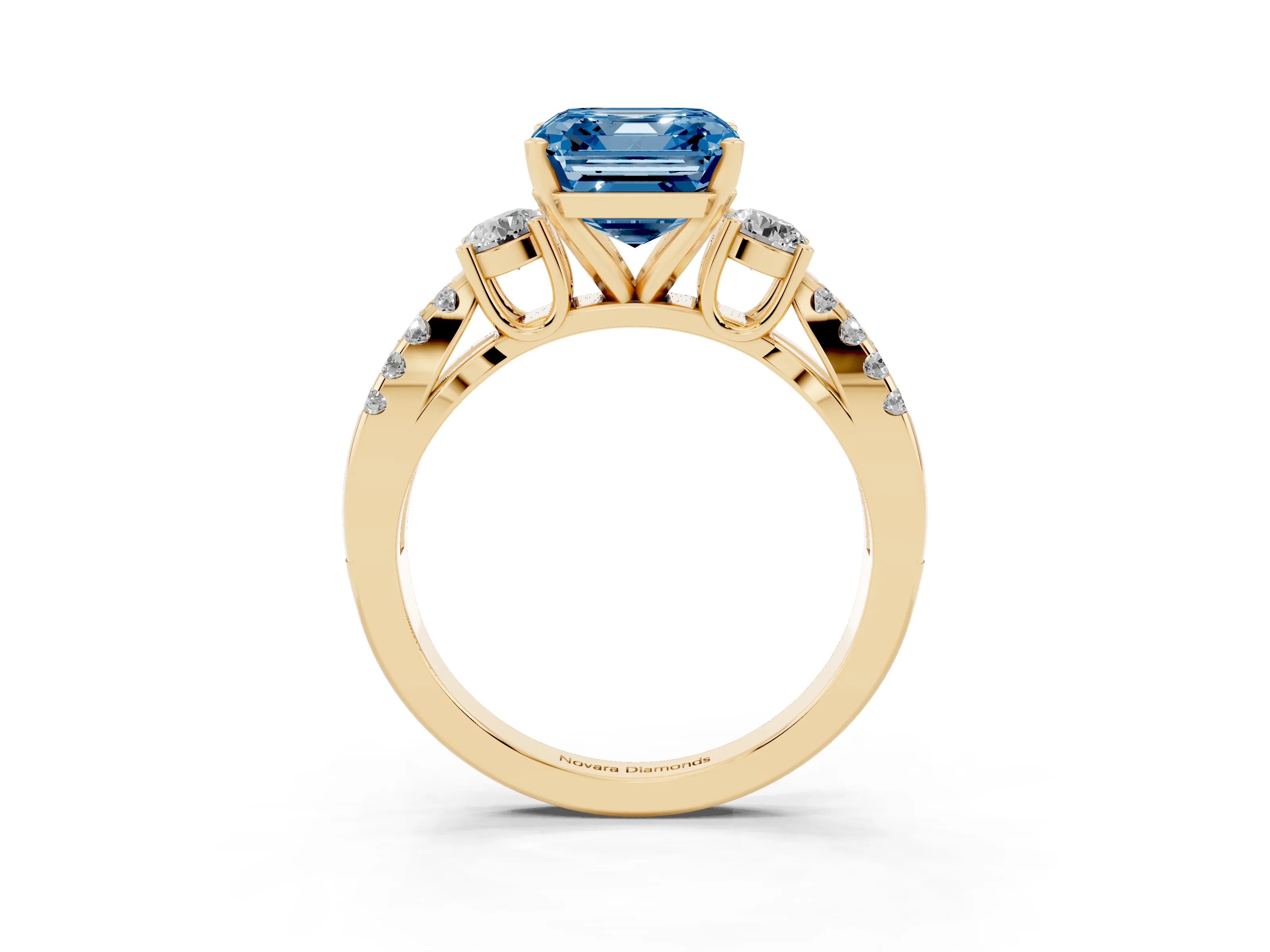 Fancy Blue Asscher Cut Diamond Three-Stone Ring Set in Yellow gold with Pavé Split Shank and Prong Setting