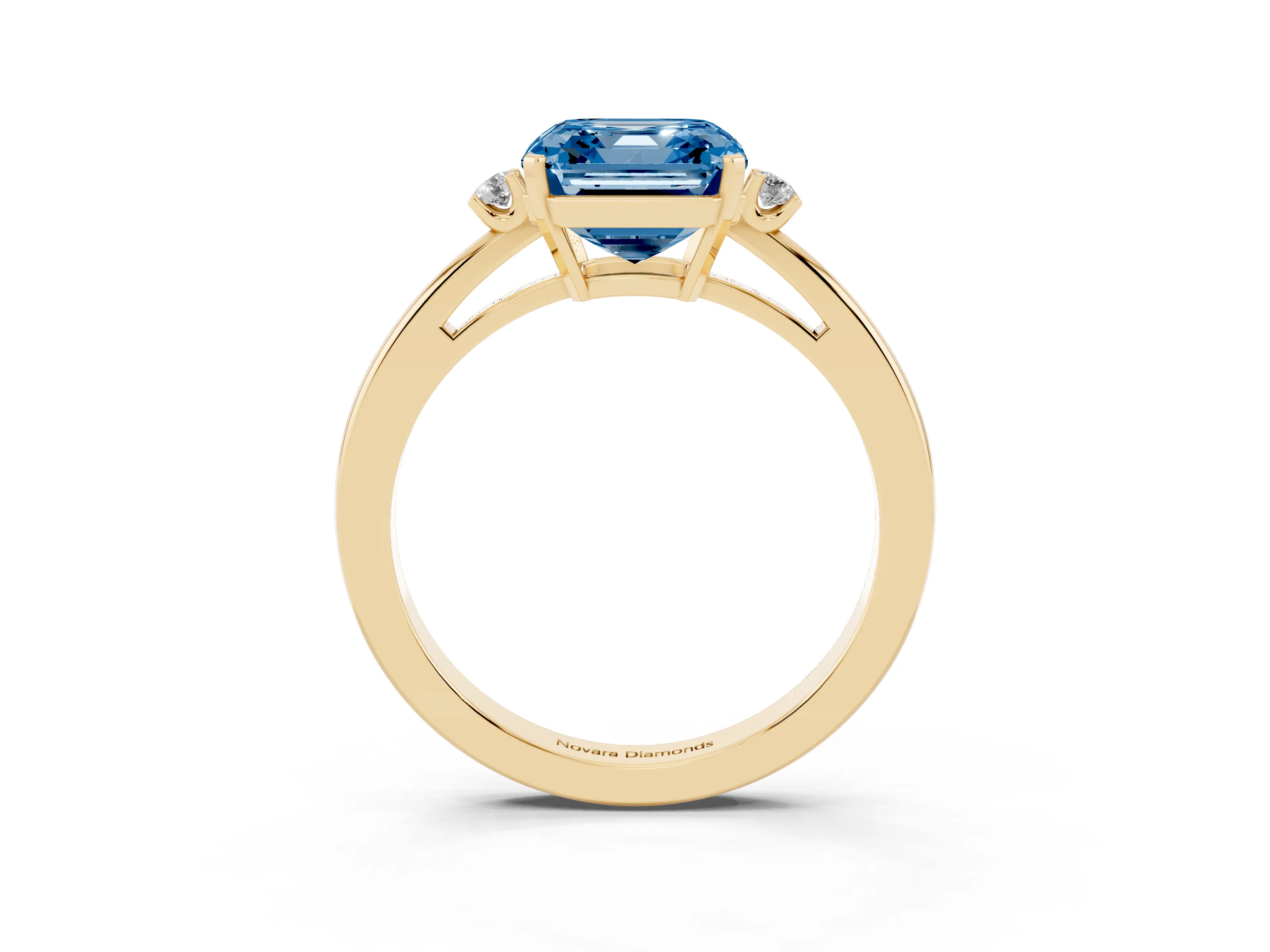Fancy Blue Three-Stone Asscher Cut Diamond Solitaire Ring Set in Yellow gold with Round Accent Stones and Prong Setting