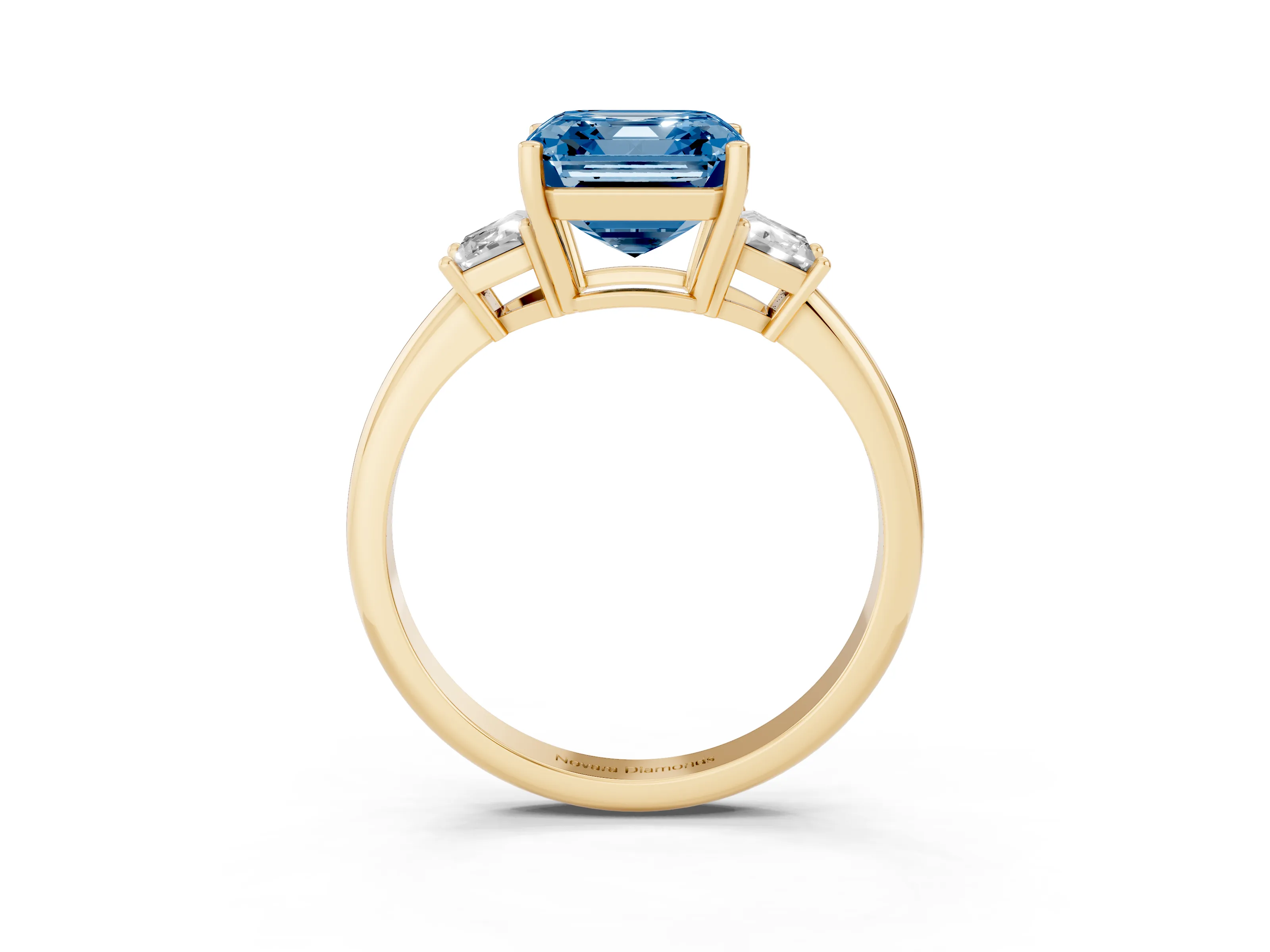 Fancy Blue Asscher Cut Diamond Three-Stone Ring Set in Yellow gold with Trapezoid Side Stones and Prong Setting