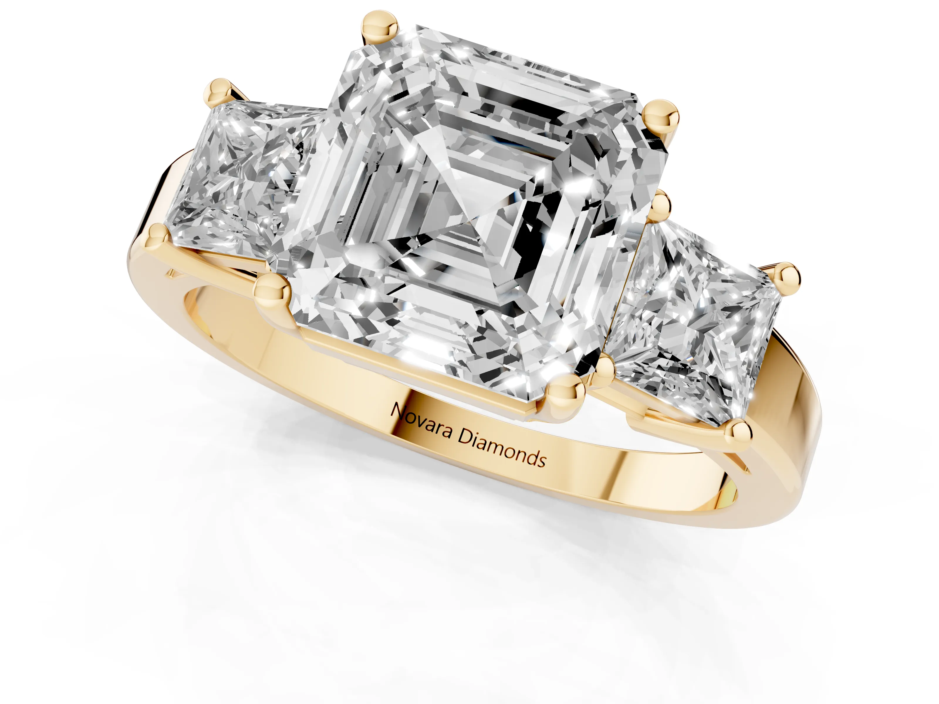 Three-Stone Asscher Cut Diamond Solitaire Ring Set in Yellow gold with Prong Setting