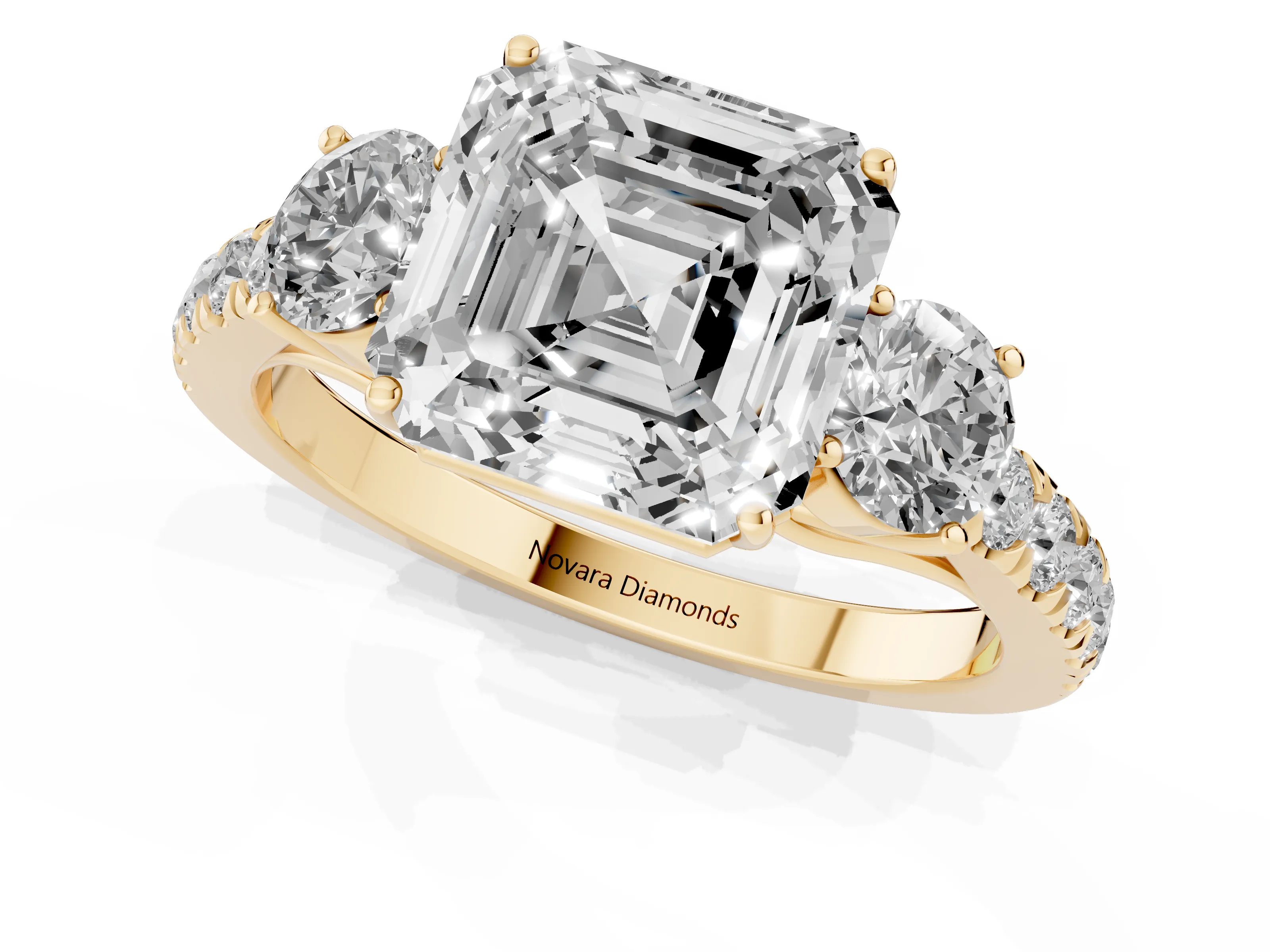 Asscher Cut Diamond Three-Stone Ring Set in Yellow gold with Round Side Stones and Delicate Pavé Band