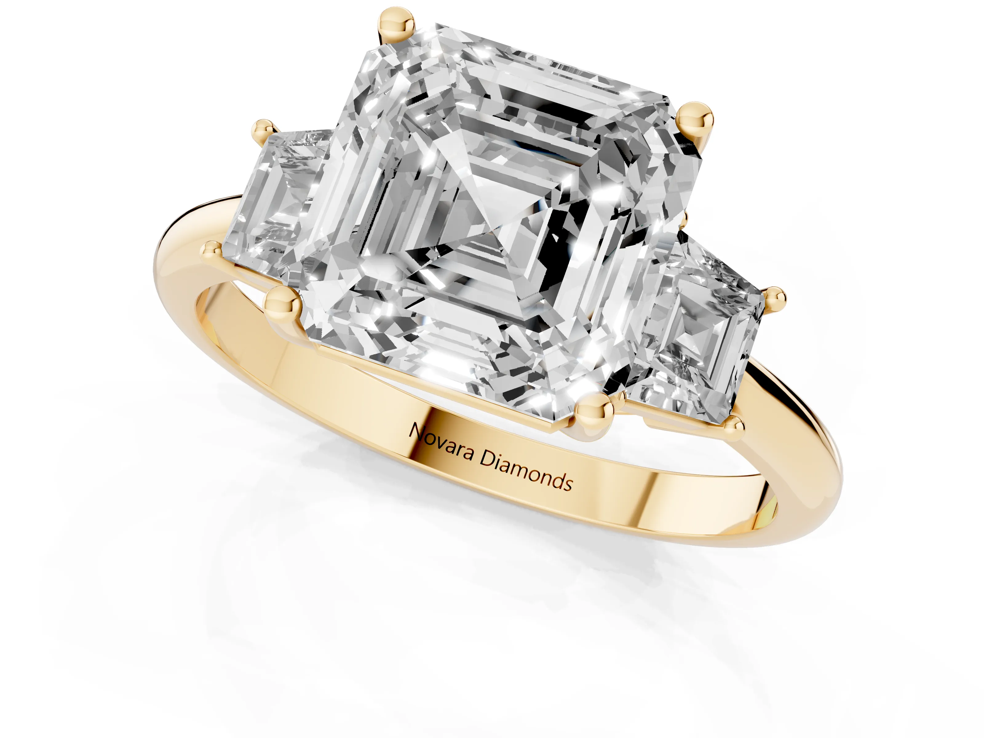 Asscher Cut Diamond Three-Stone Ring Set in Yellow gold with Trapezoid Side Stones and Prong Setting