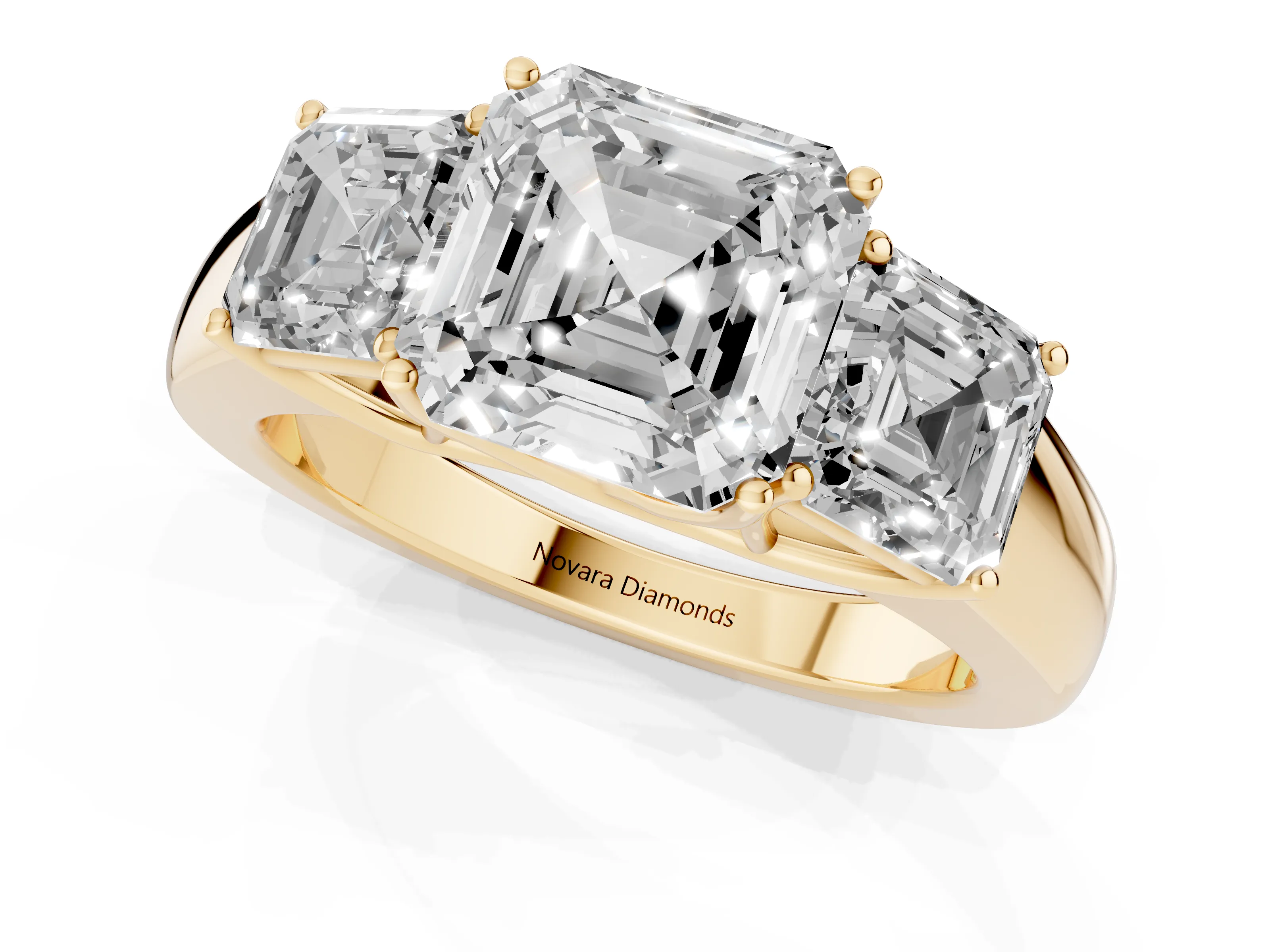 Three-Stone Asscher Cut Diamond Ring Set in Yellow gold with Matching Prong Settings and Plain Band