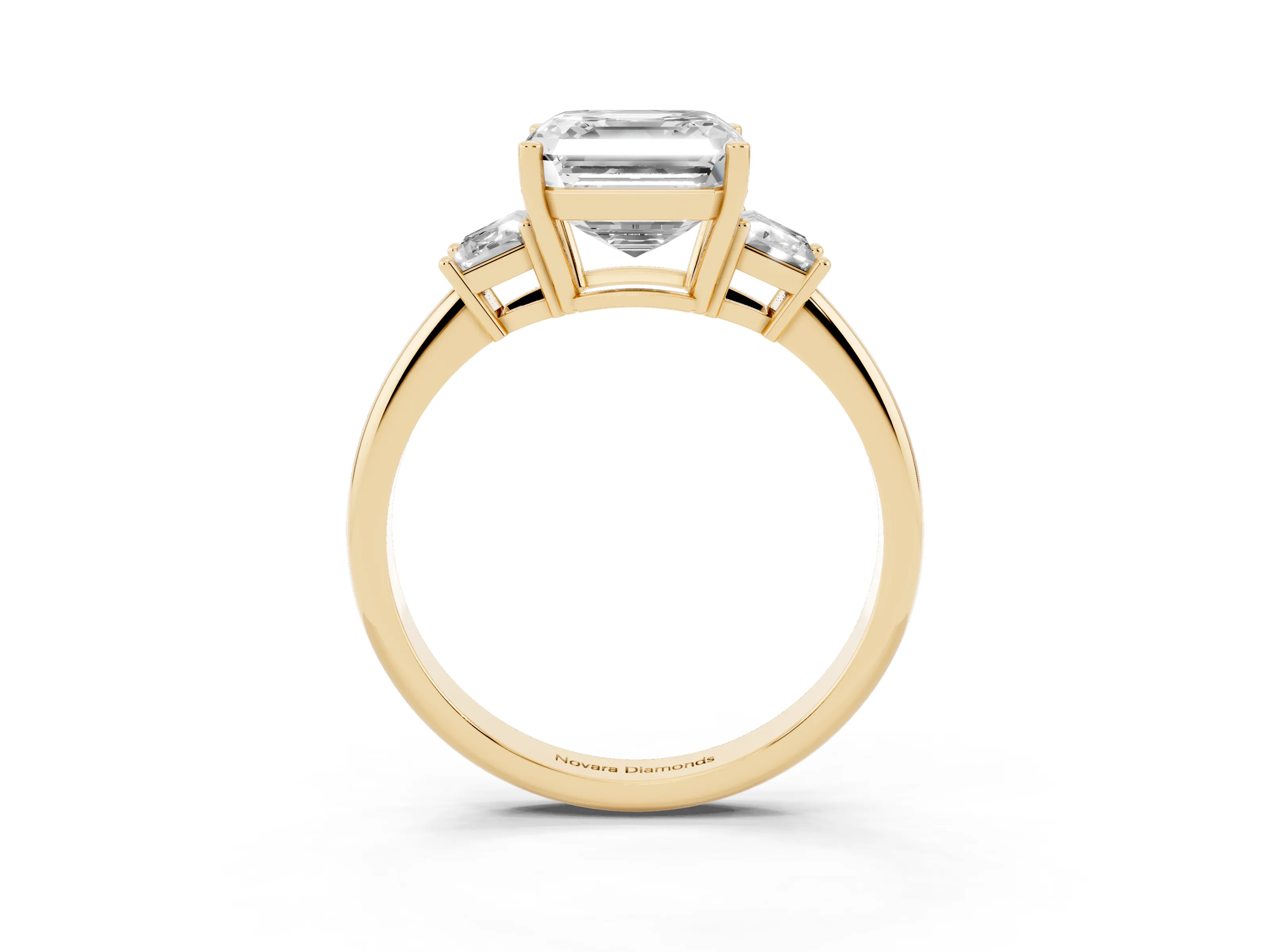 Asscher Cut Diamond Three-Stone Ring Set in Yellow gold with Trapezoid Side Stones and Prong Setting