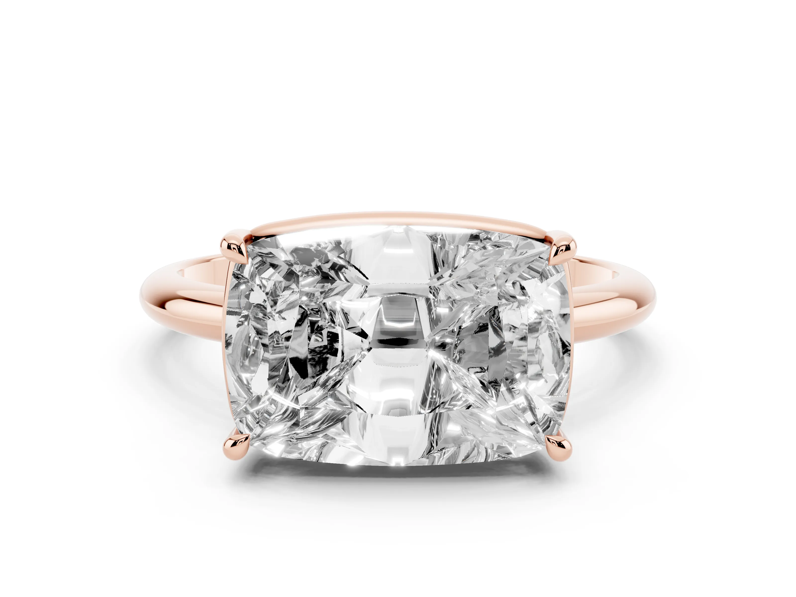 Old Mine Elongated Cushion Diamond East-West Solitaire Ring Set in Rose gold with Bezel and Four Claw Setting