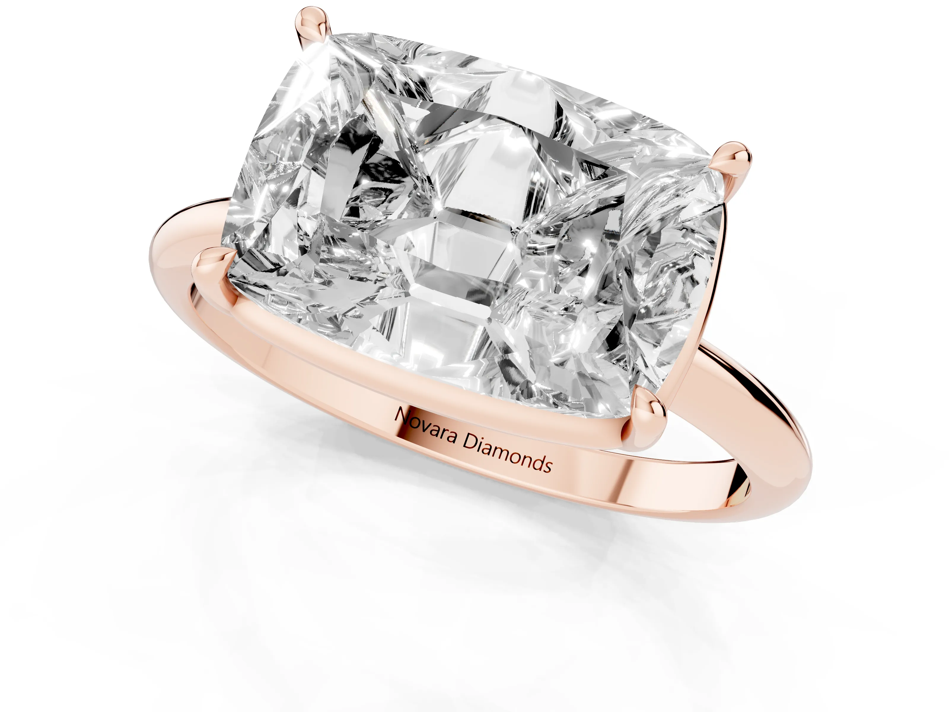 Old Mine Elongated Cushion Diamond East-West Solitaire Ring Set in Rose gold with Bezel and Four Claw Setting