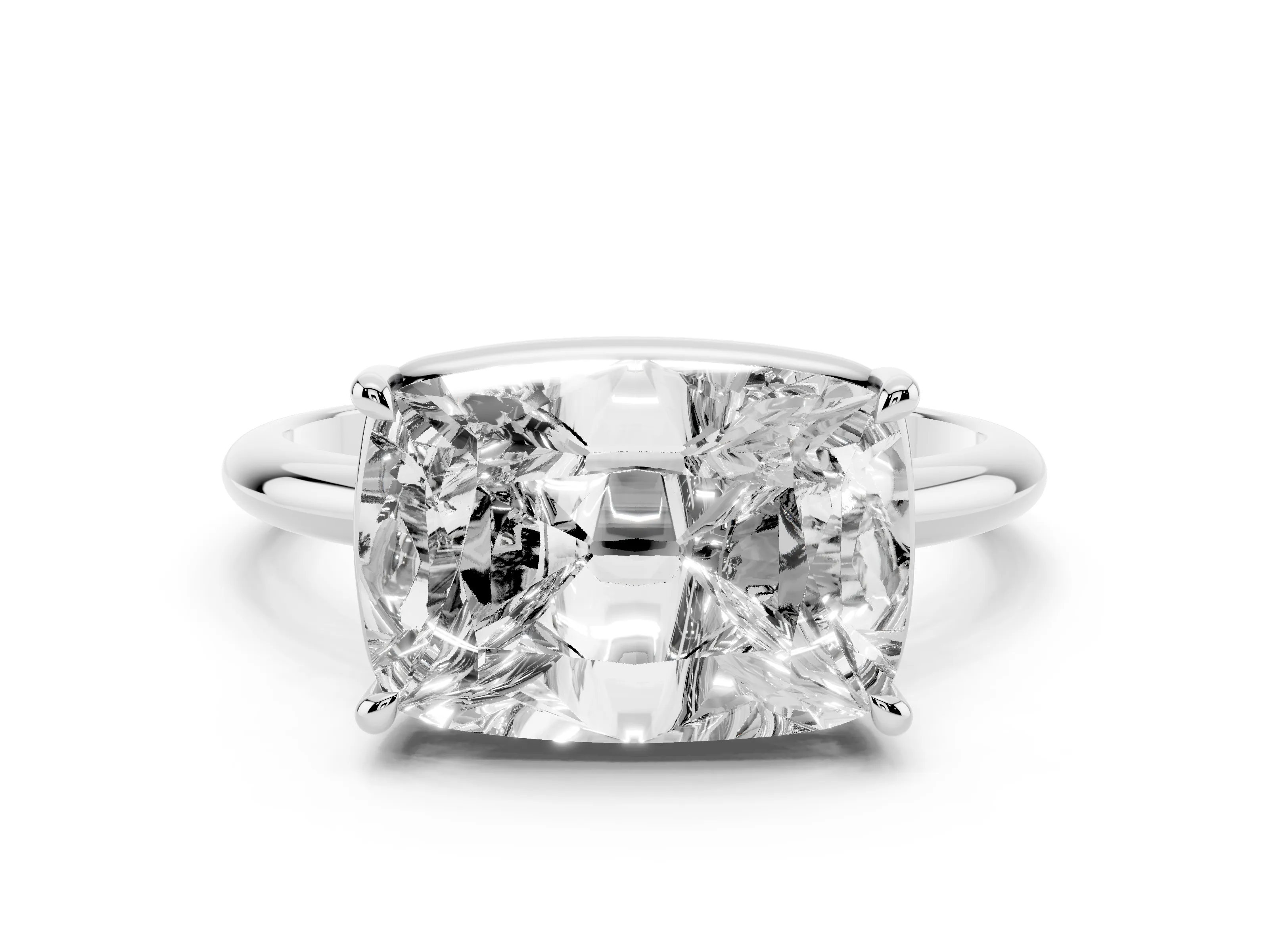 Old Mine Elongated Cushion Diamond East-West Solitaire Ring Set in White gold with Bezel and Four Claw Setting