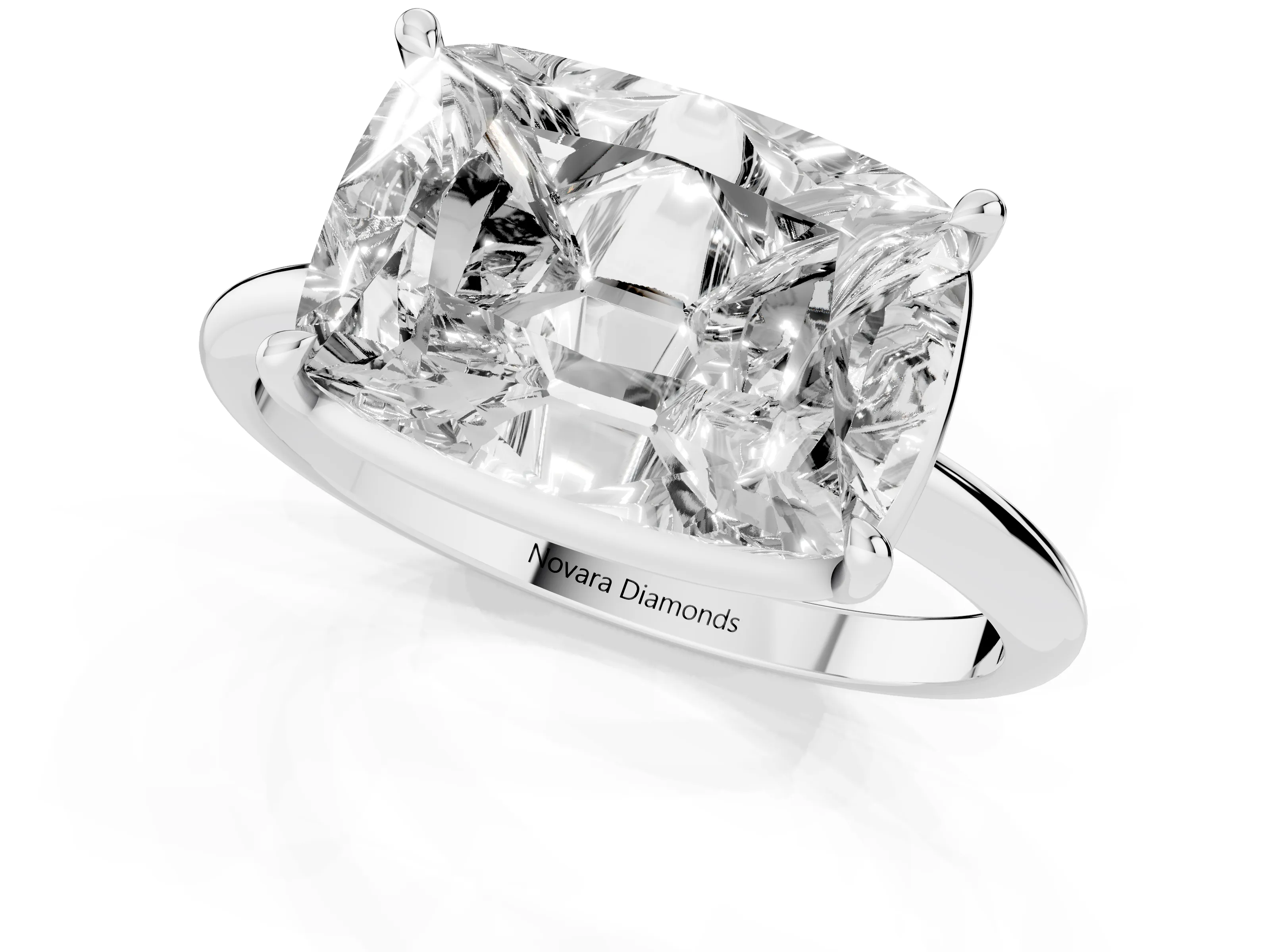 Old Mine Elongated Cushion Diamond East-West Solitaire Ring Set in White gold with Bezel and Four Claw Setting