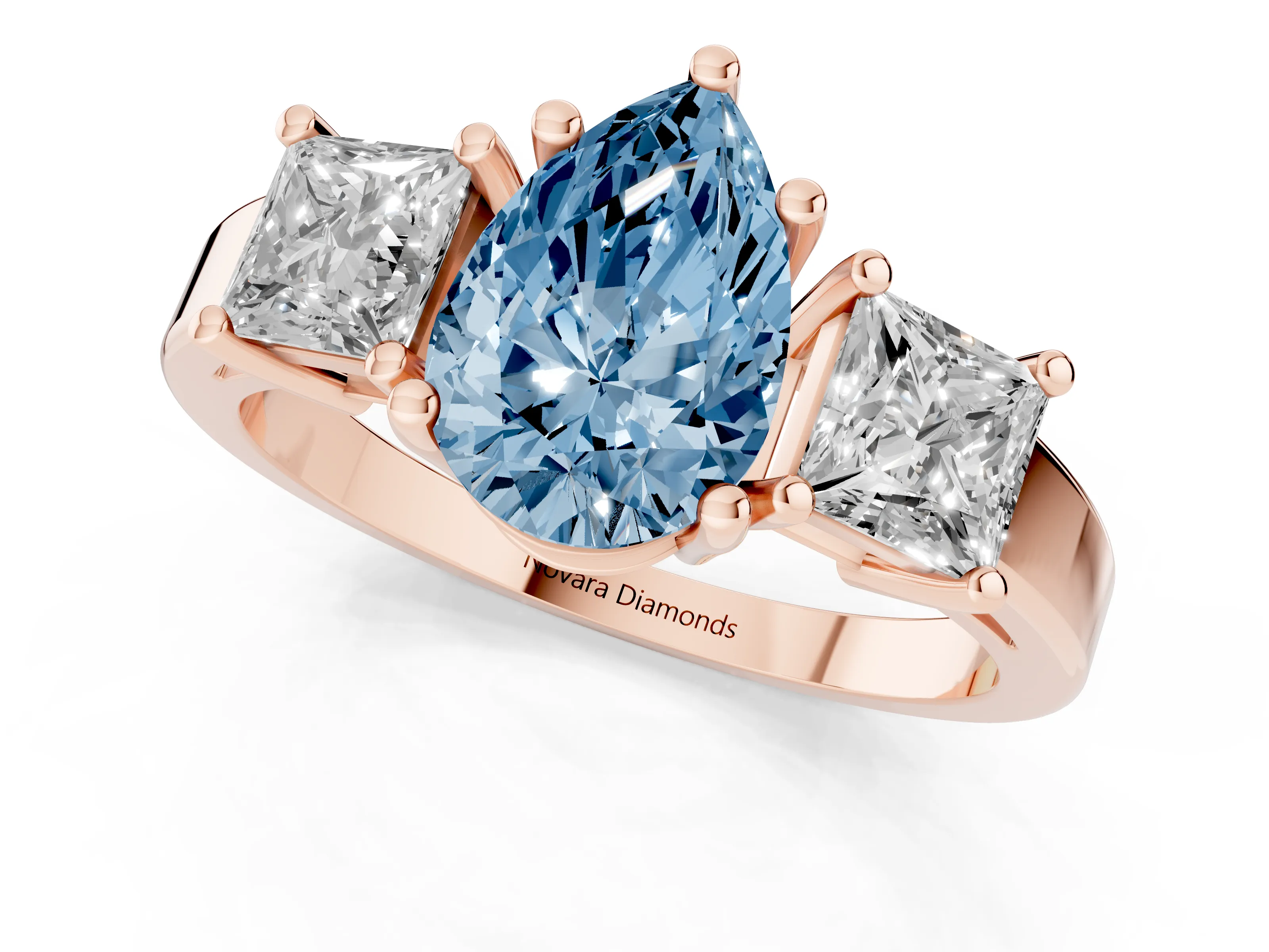 Fancy Blue Three-Stone Pear Cut Diamond Solitaire Ring Set in Rose gold with Prong Setting