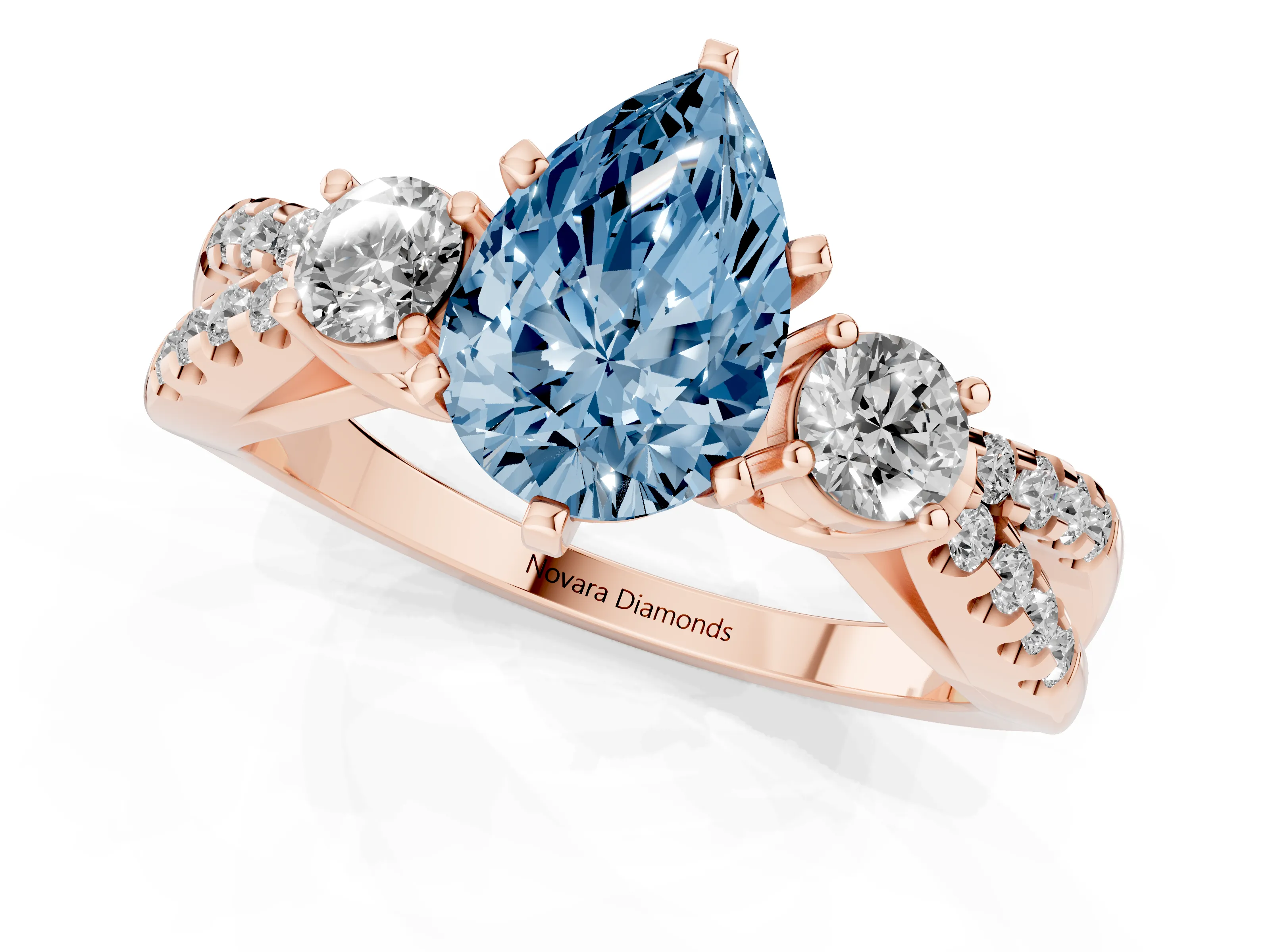 Fancy Blue Pear Cut Diamond Three-Stone Ring Set in Rose gold with Pavé Split Shank and Prong Setting