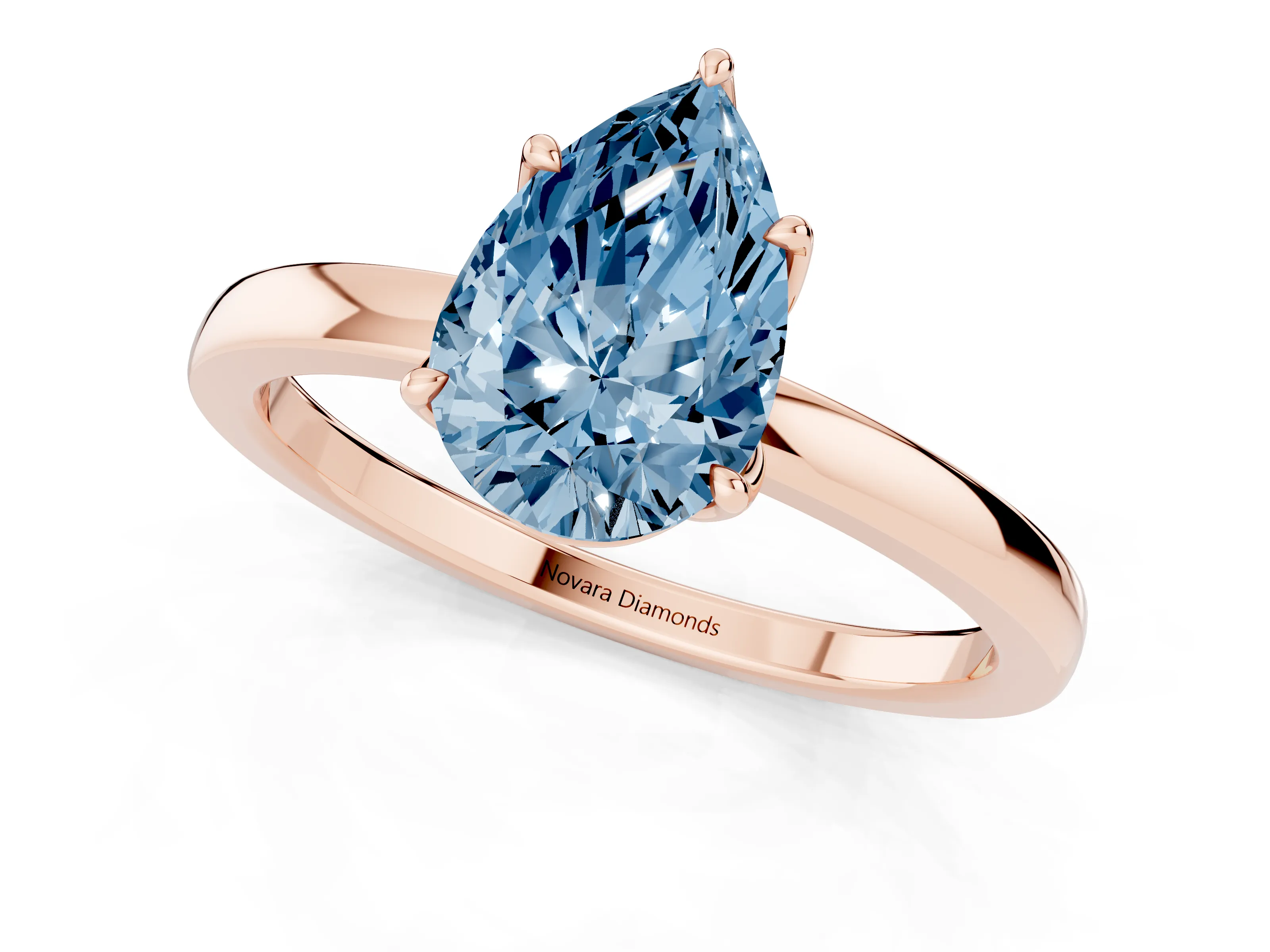 Fancy Blue Pear Cut Diamond Solitaire Ring Set in Rose gold with Prong Setting and Thin Polished Band