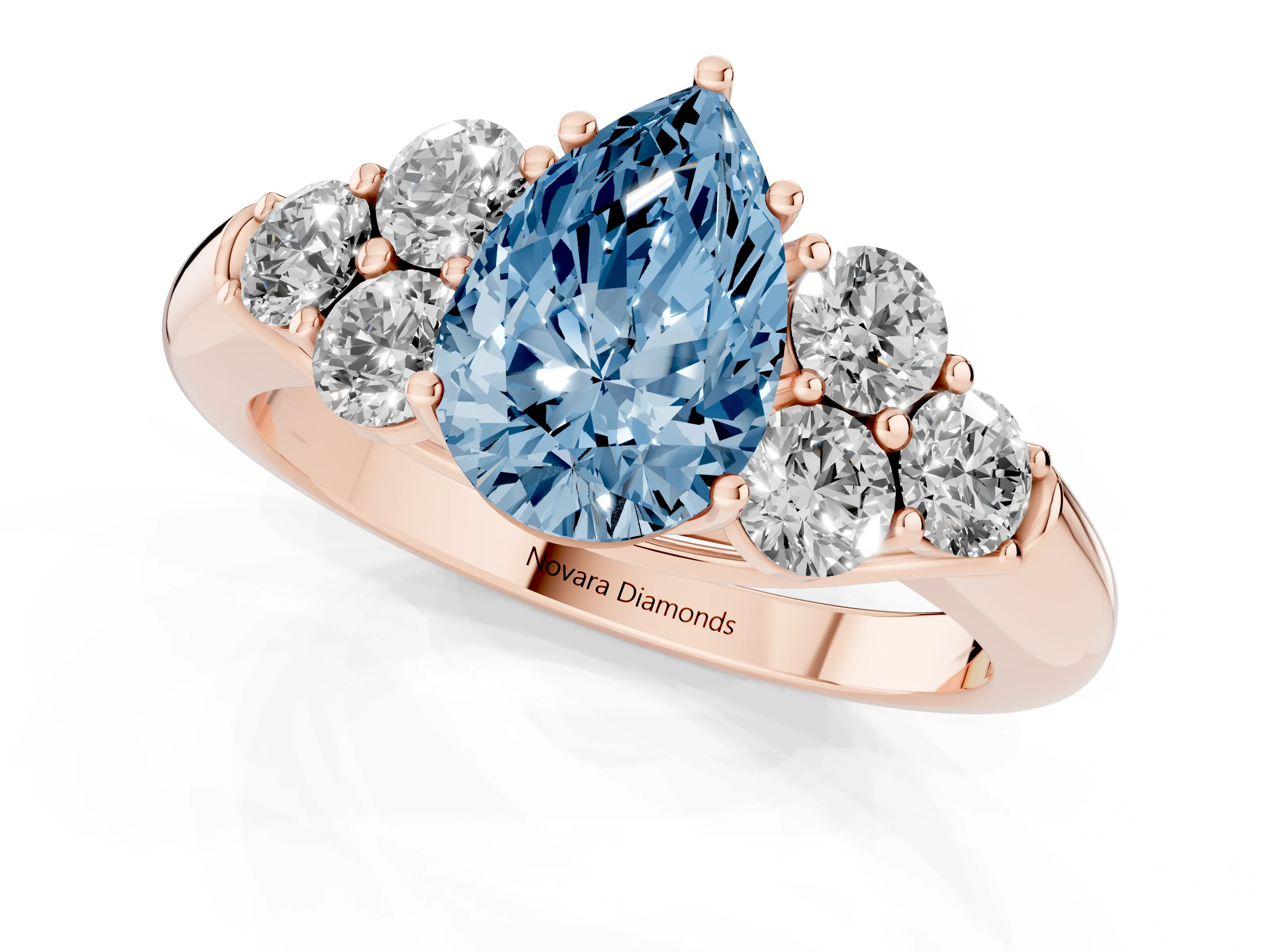 Fancy Blue Pear Cut Diamond Cluster Ring Set in Rose gold with Round Accent Stones and Prong Setting on a Plain Band