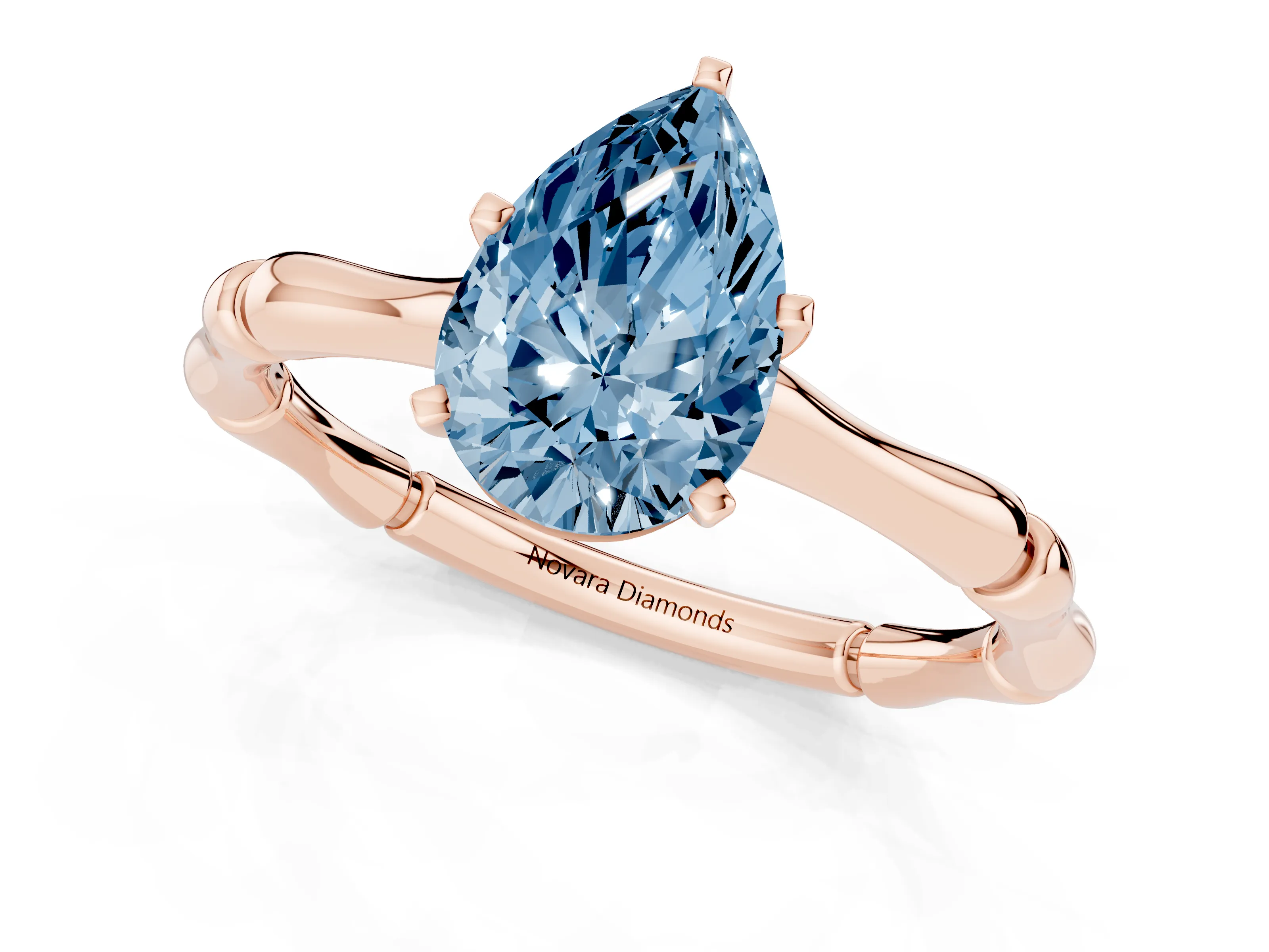 Fancy Blue Pear Cut Diamond Solitaire Ring Set in Rose gold with Bamboo Band and Prong Setting