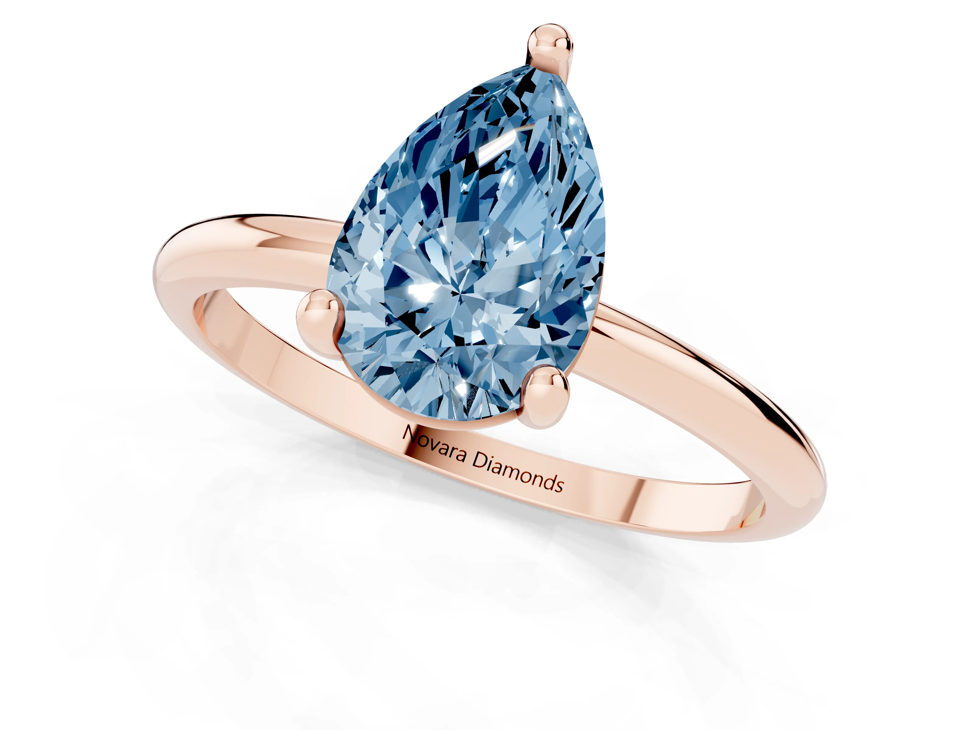 Fancy Blue Pear Cut Diamond Solitaire Ring Set in Rose gold with Secure Prong Setting on a Classic Band