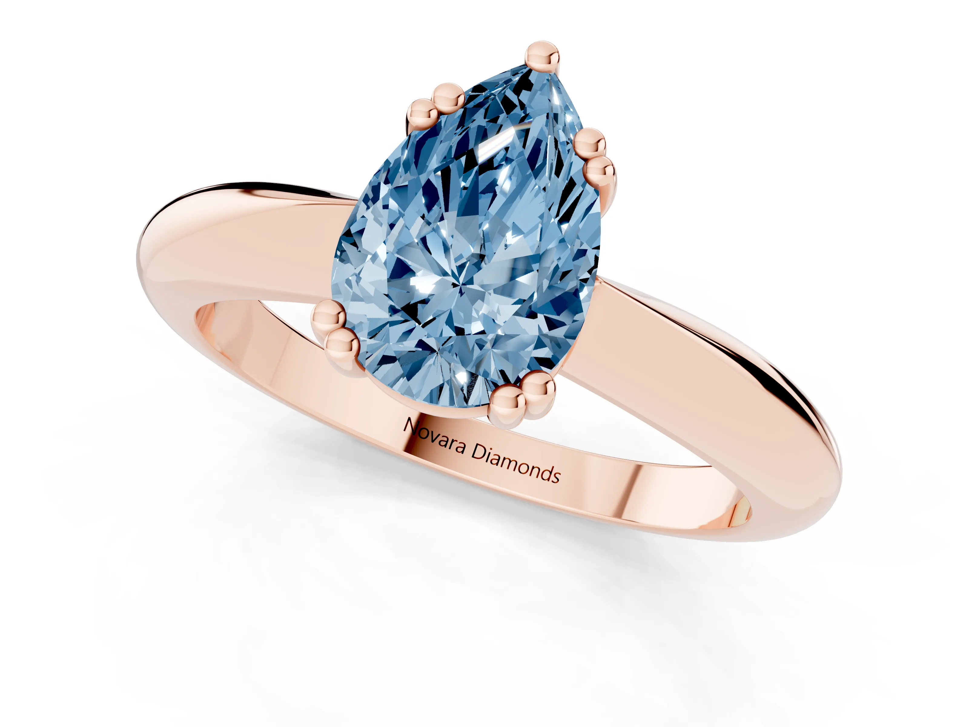 Fancy Blue Pear Cut Diamond Solitaire Engagement Ring Set in Rose gold with Tapered Band and Prong Setting