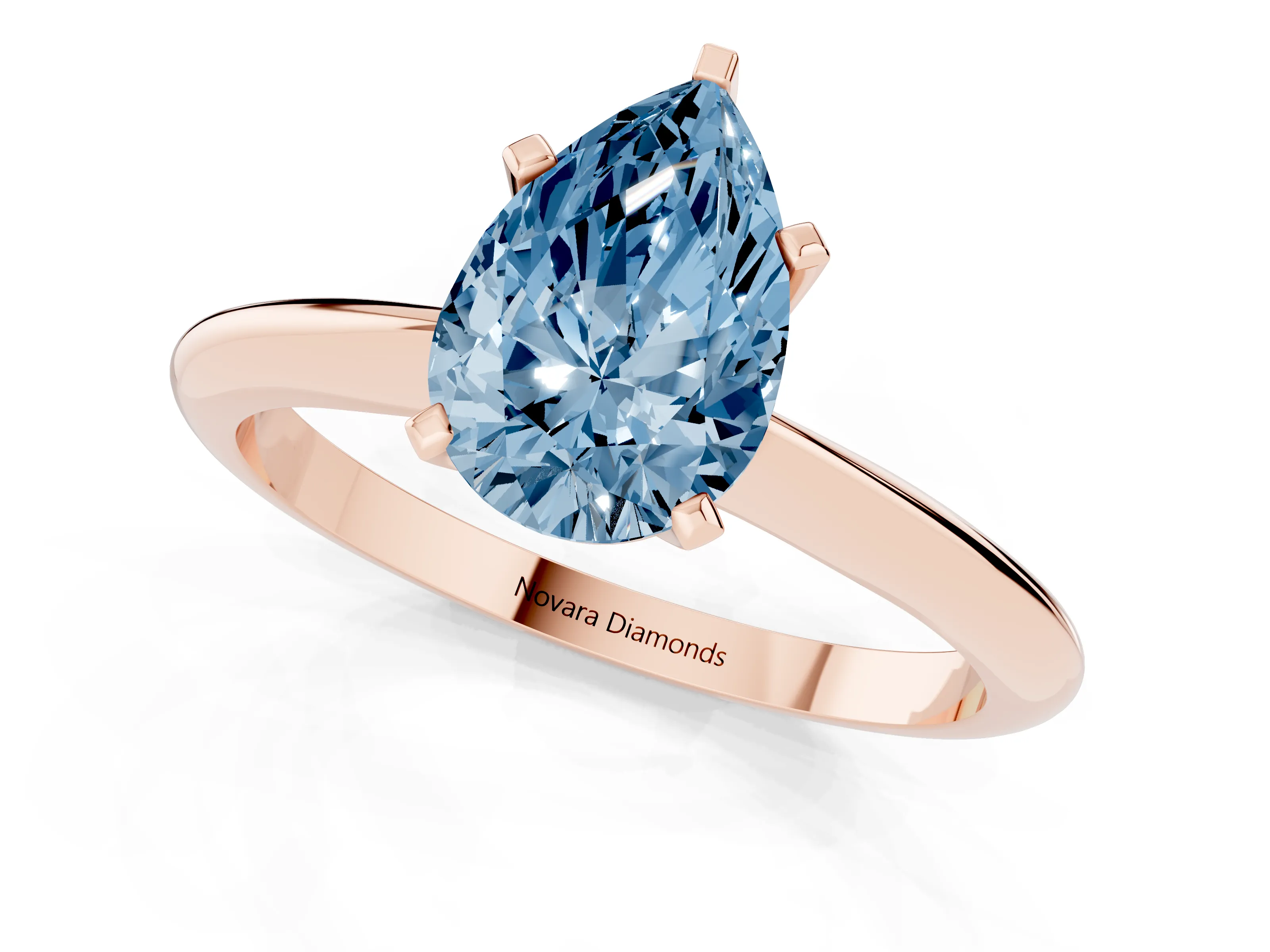 Fancy Blue Pear Cut Diamond Solitaire Ring Set in Rose gold with Prong Setting on a Plain Round Band