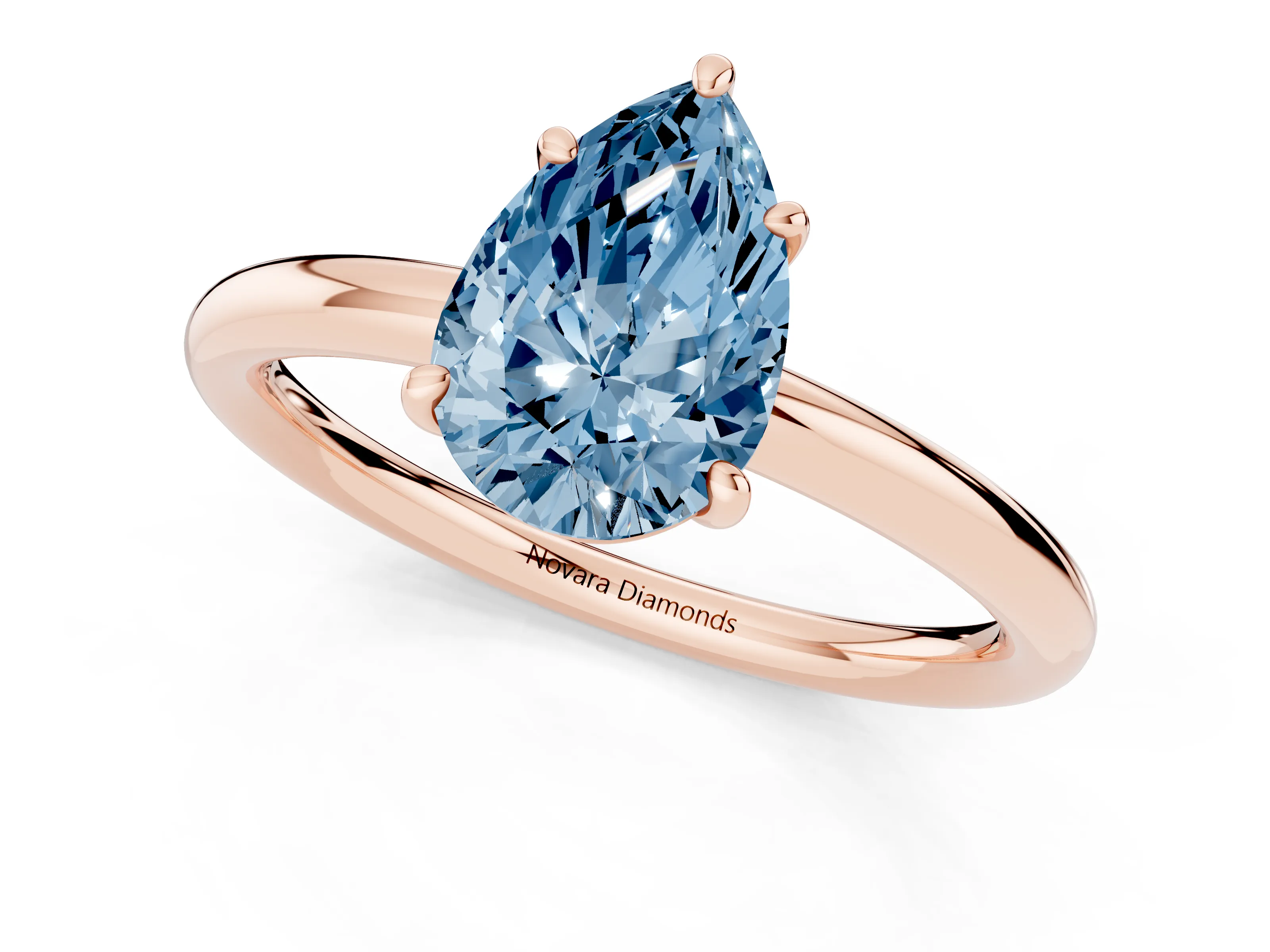 Fancy Blue Pear Cut Diamond Solitaire Ring Set in Rose gold with Prong Setting on a Polished Plain Band