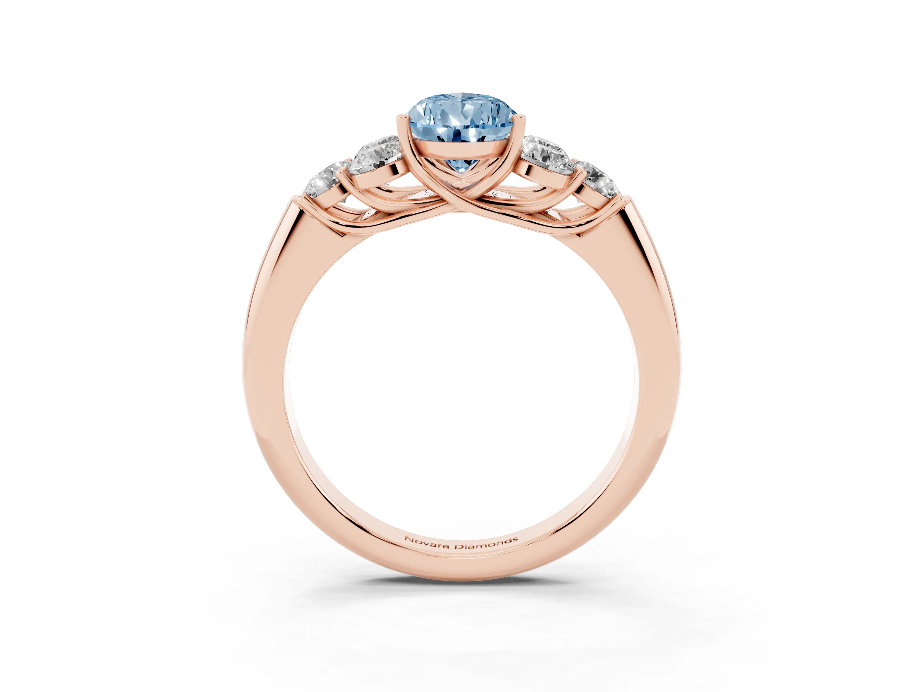 Fancy Blue Pear Cut Diamond Cluster Ring Set in Rose gold with Round Accent Stones and Prong Setting on a Plain Band