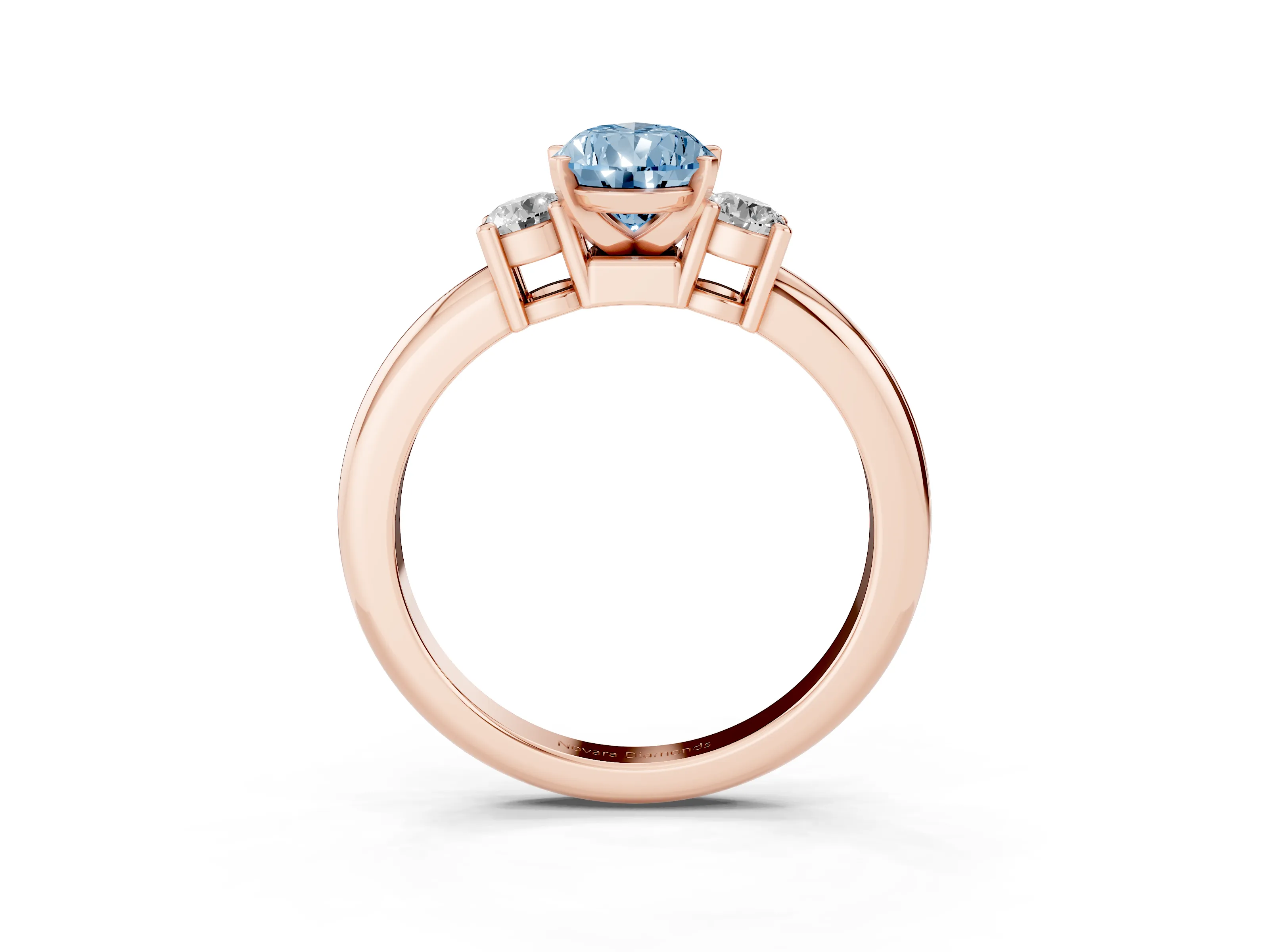 Fancy Blue Three-Stone Pear Cut Diamond Ring Set in Rose gold with Prong Setting and Plain Band