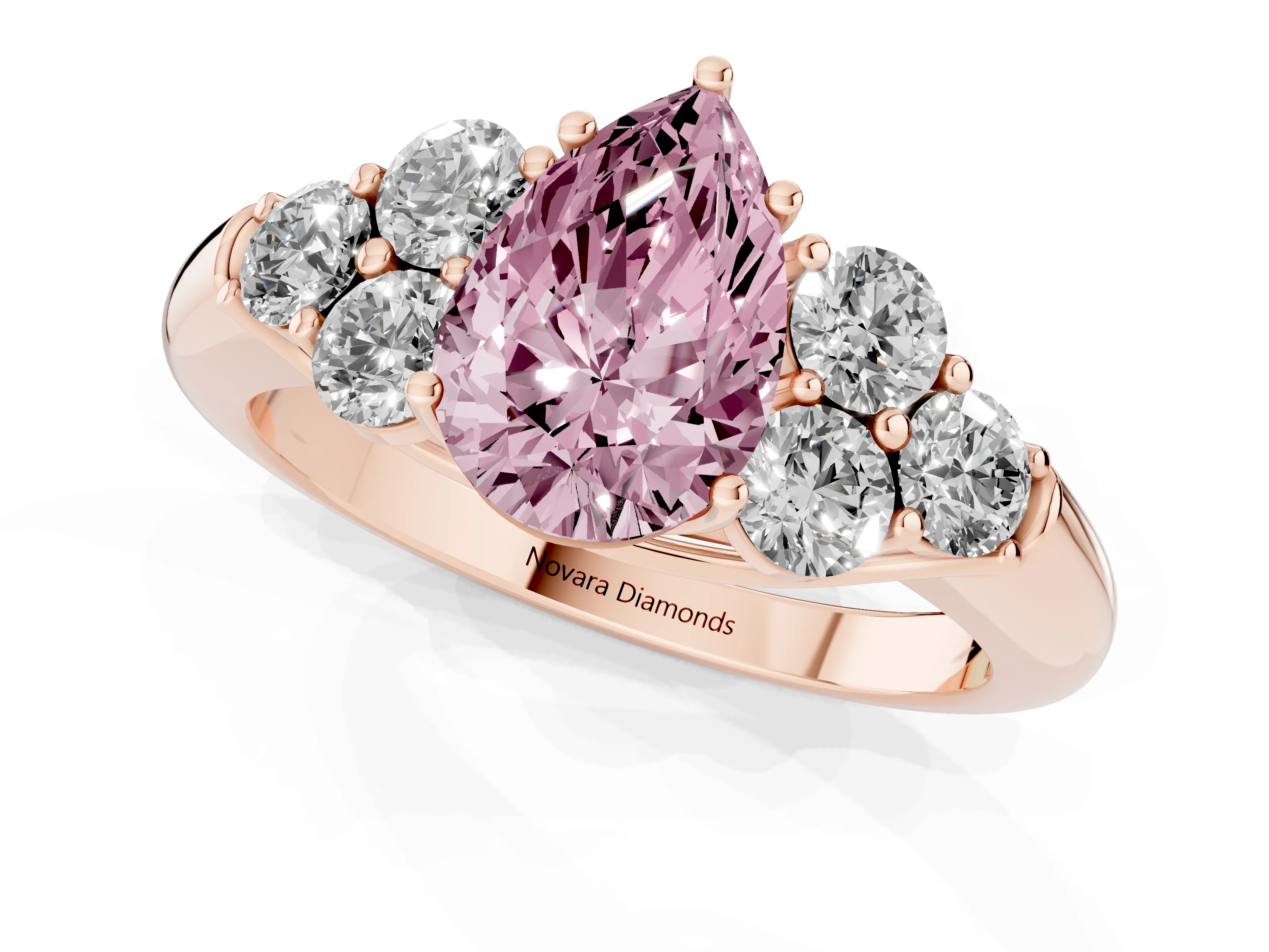 Fancy Pink Pear Cut Diamond Cluster Ring Set in Rose gold with Round Accent Stones and Prong Setting on a Plain Band