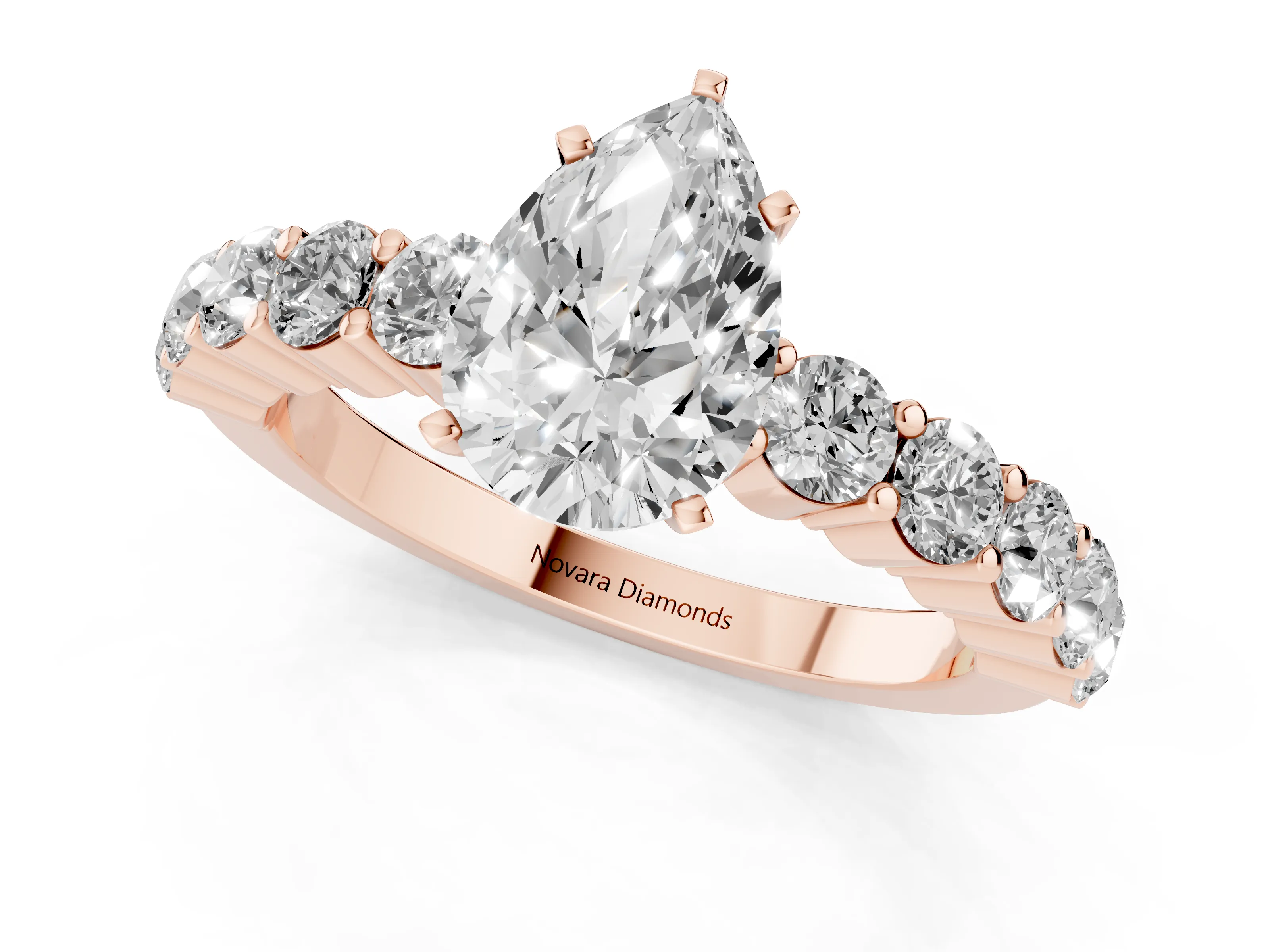 Pear Cut Diamond Solitaire Ring Set in Rose gold with Shared Prong Round Side Stones