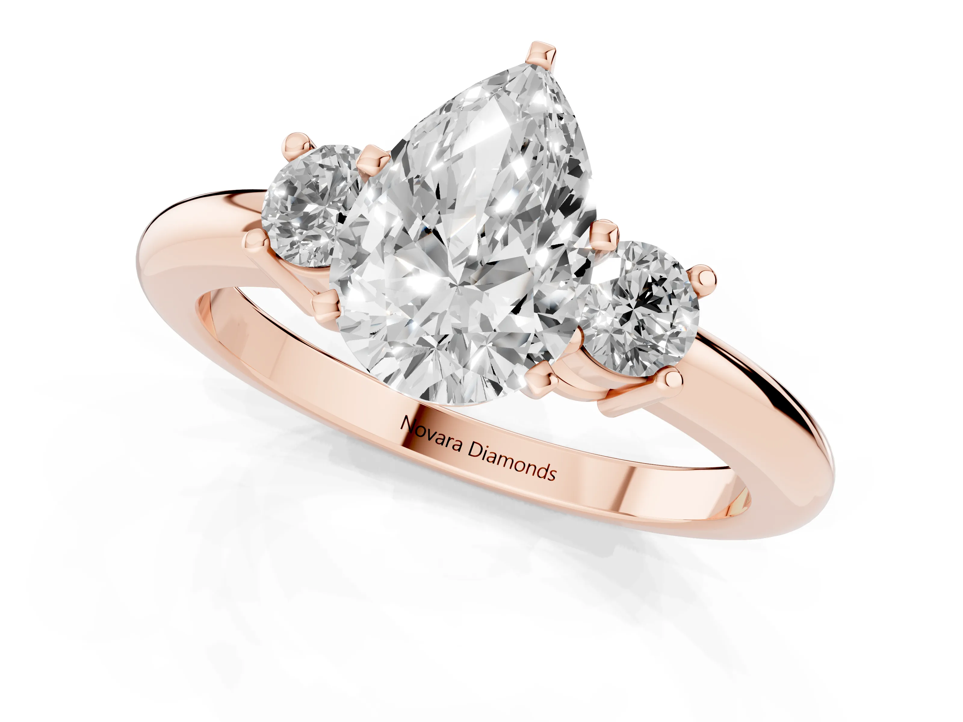 Three-Stone Pear Cut Diamond Ring Set in Rose gold with Prong Setting and Plain Band