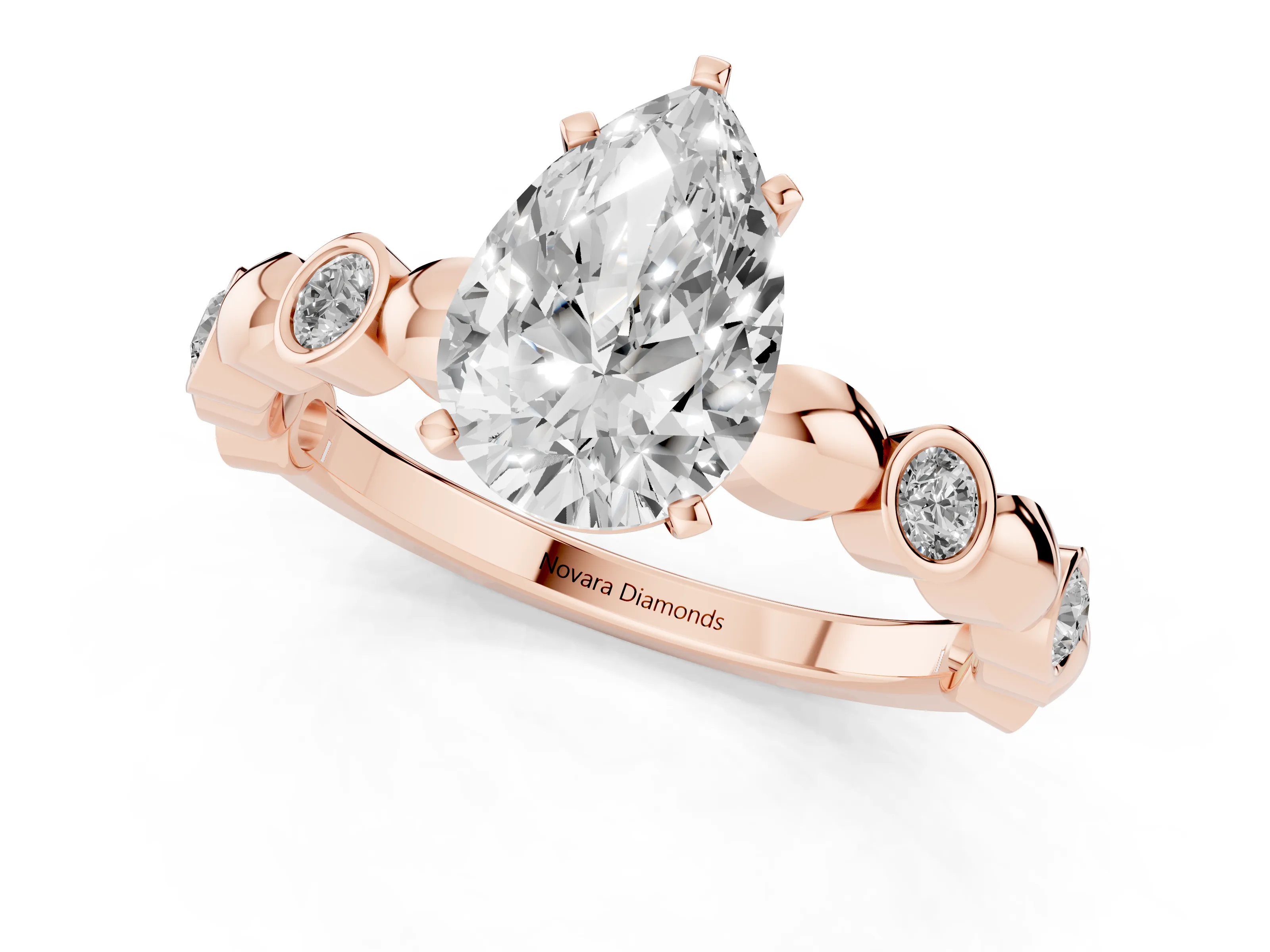 Pear Cut Diamond Solitaire Ring Set in Rose gold with Bezel-Set Accents on Beaded Band and Prong Setting