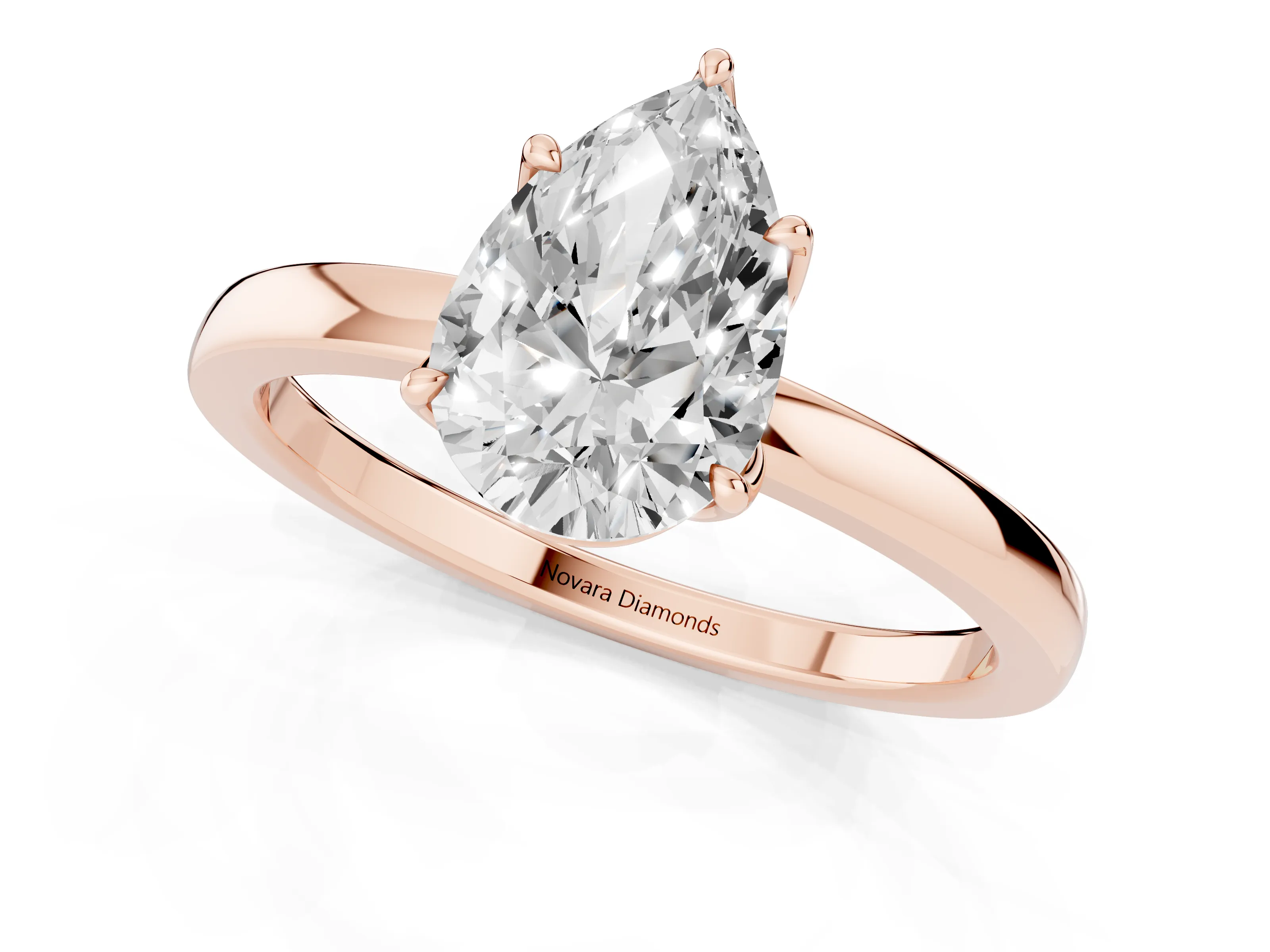 Pear Cut Diamond Solitaire Ring Set in Rose gold with Prong Setting and Thin Polished Band