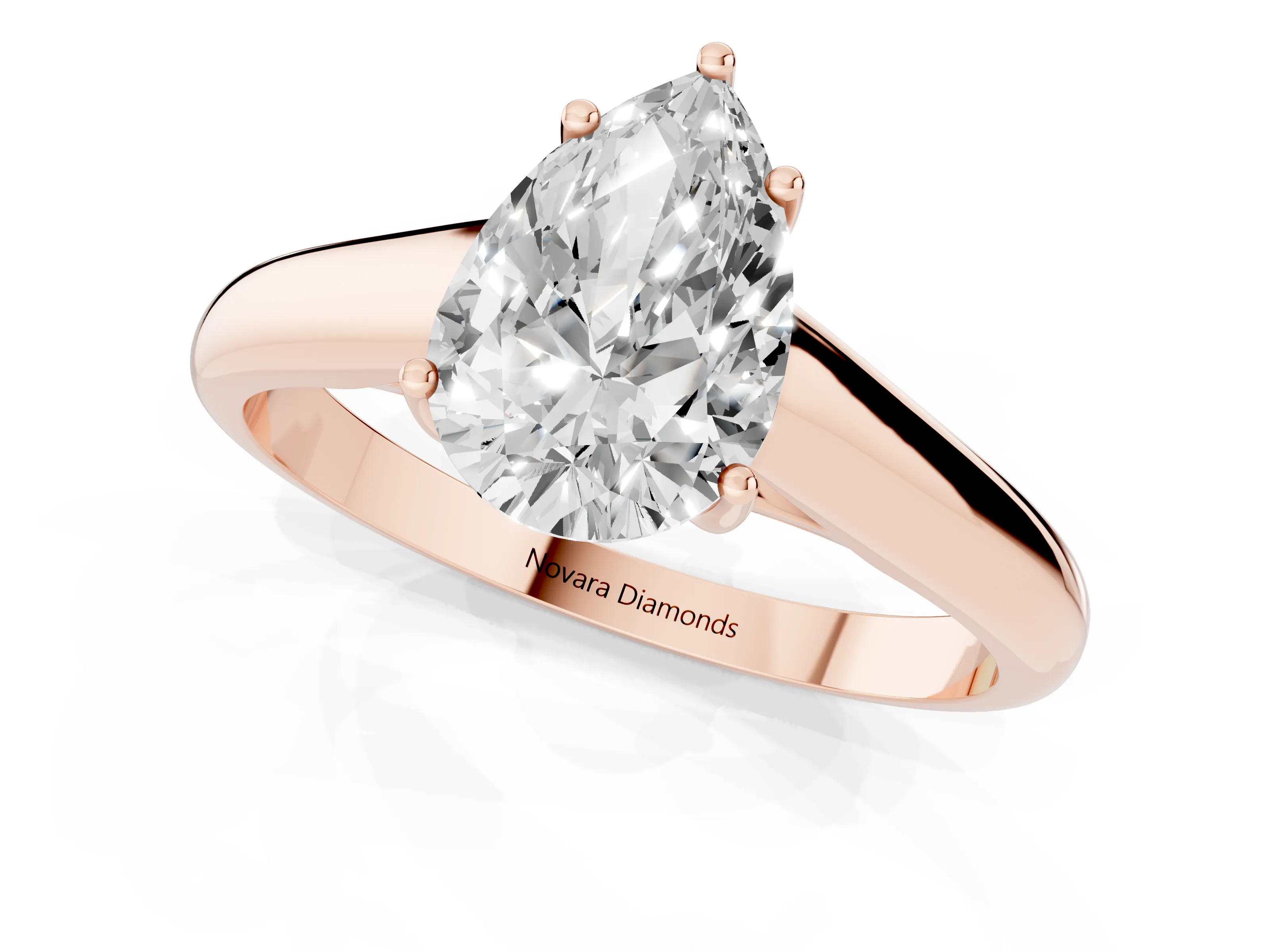 Pear Cut Diamond Solitaire Engagement Ring Set in Rose gold with Subtly Tapered Band and Prong Setting