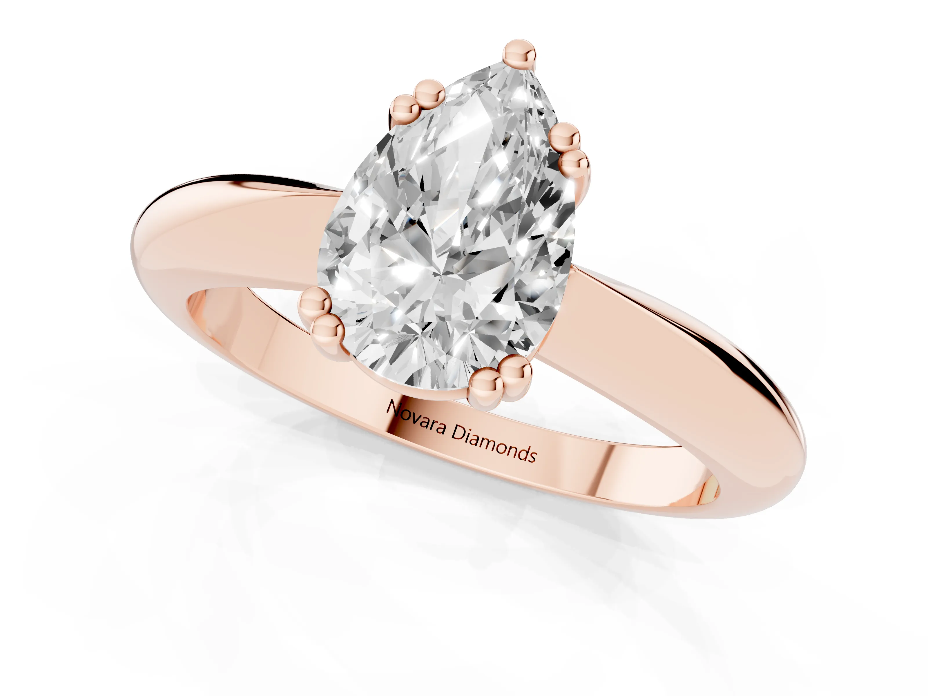 Pear Cut Diamond Solitaire Engagement Ring Set in Rose gold with Tapered Band and Prong Setting