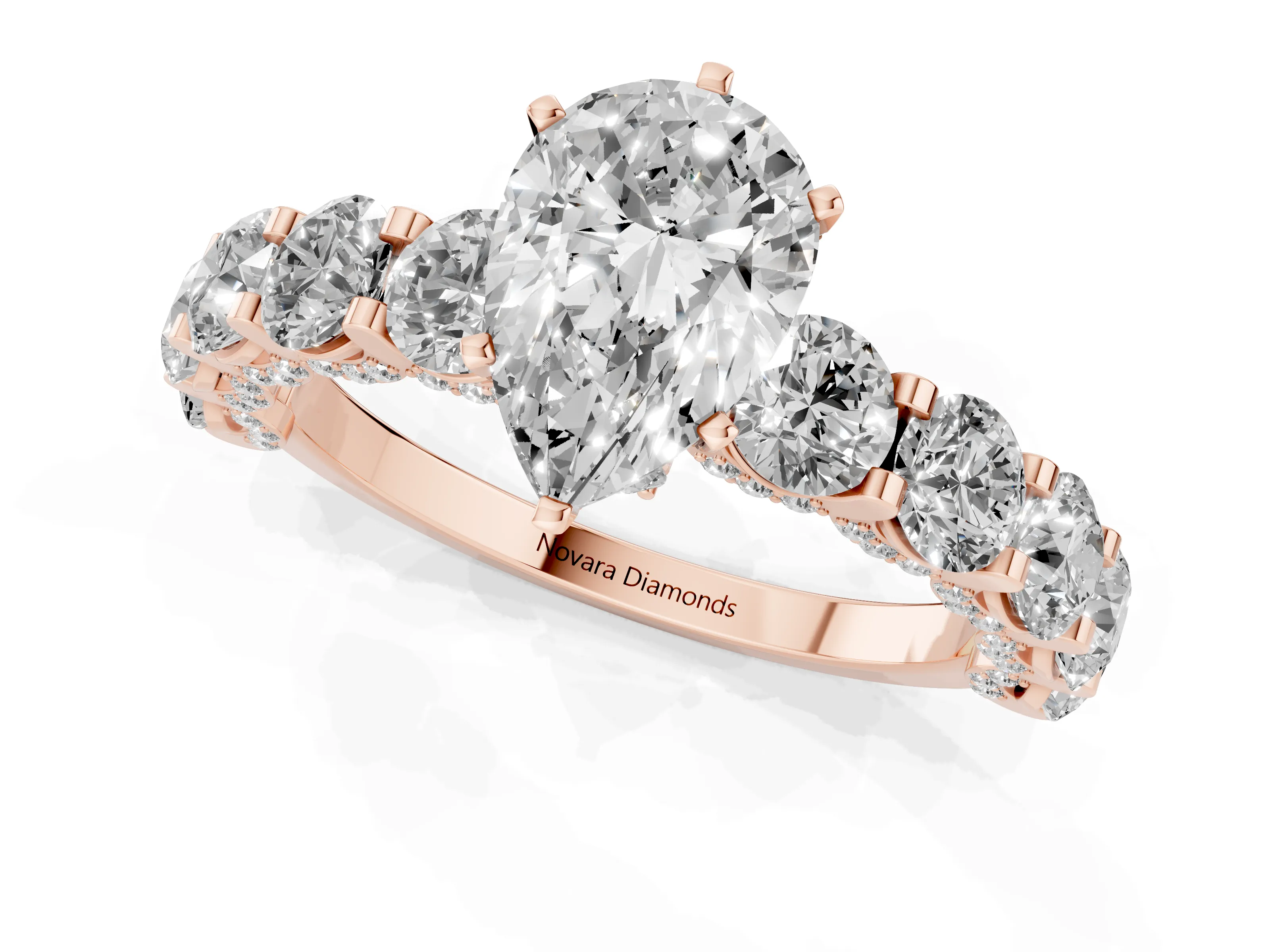 Pear Cut Diamond Side Stone Ring Set in Rose gold with Alternating Round and Oval Side Stones