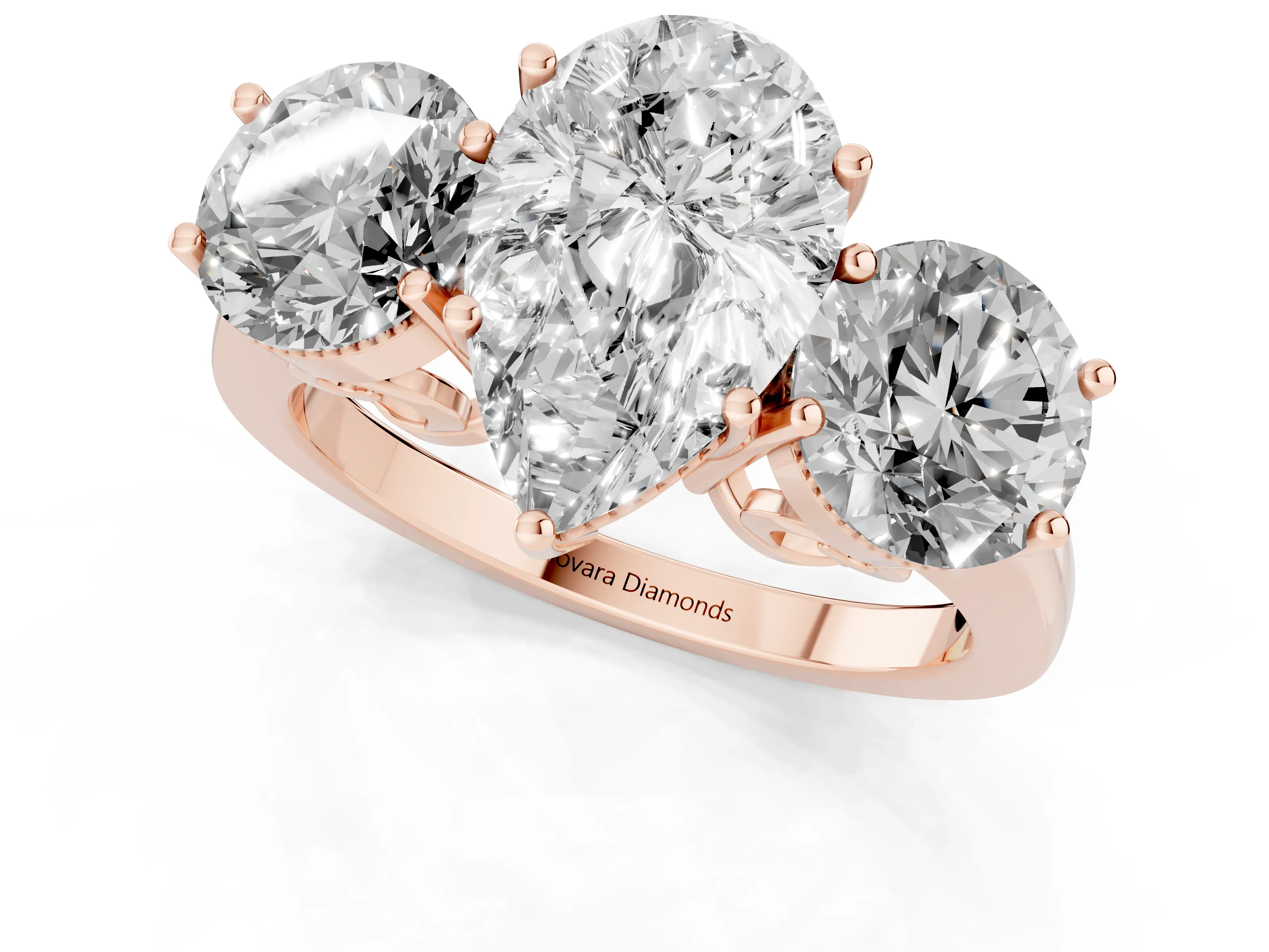 Pear Cut Diamond Three-Stone Engagement Ring Set in Rose gold with Polished Band