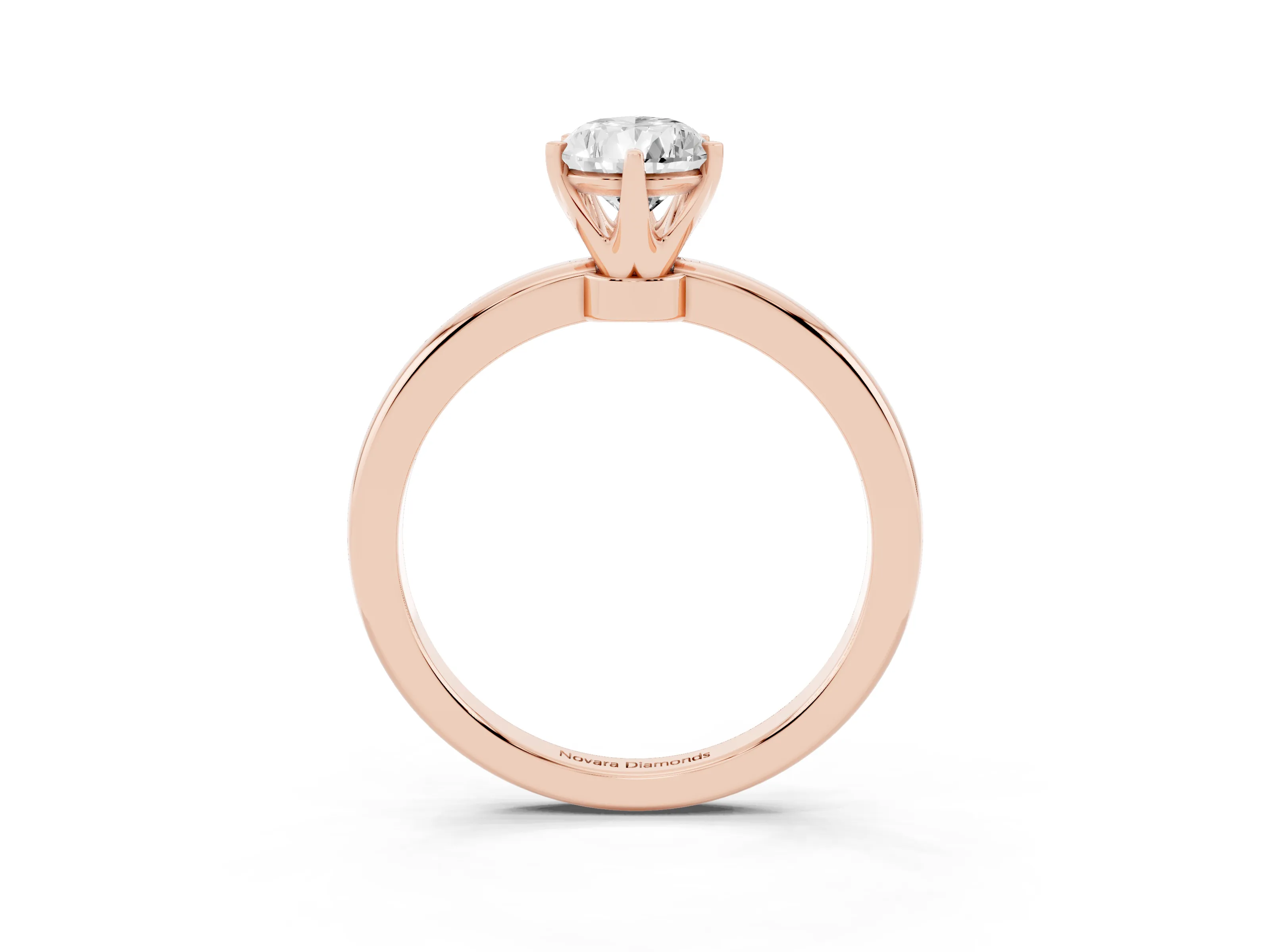 Pear Cut Diamond Solitaire Ring Set in Rose gold with Raised Prong Setting on a Classic Band