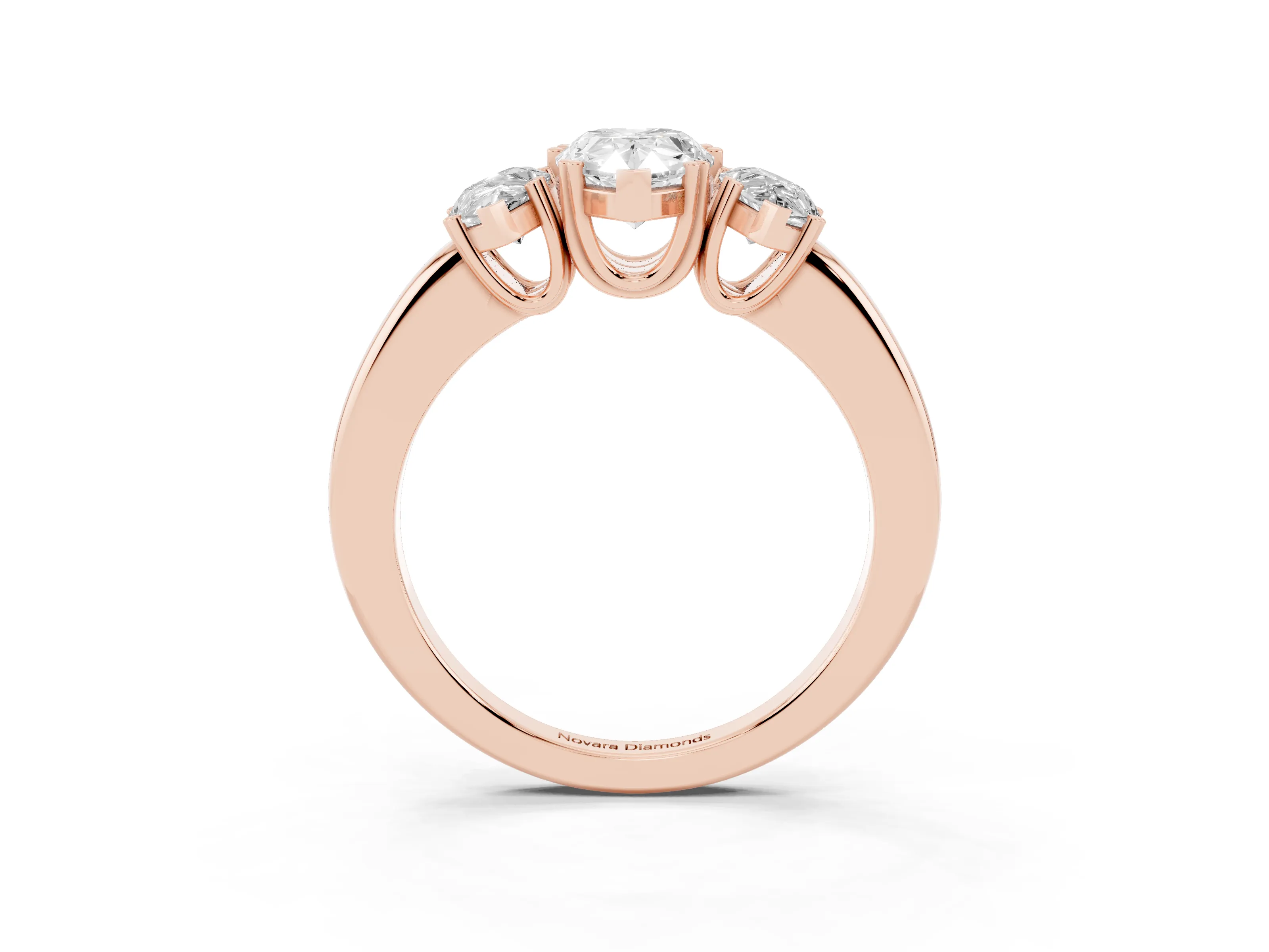 Pear Cut Diamond Three-Stone Ring Set in Rose gold with Polished Channel-Set Band
