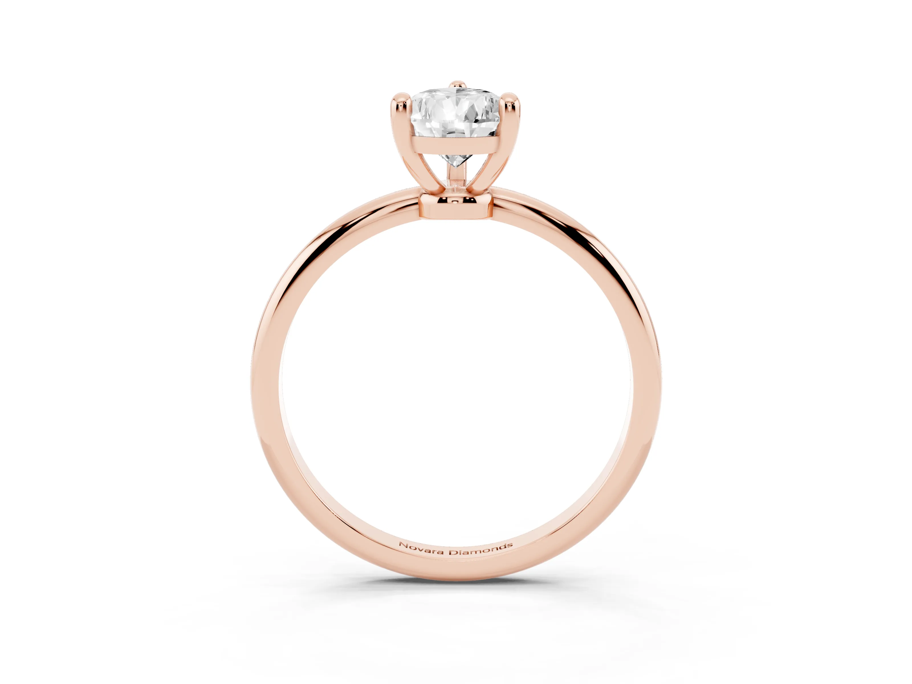 Pear Cut Diamond Solitaire Ring Set in Rose gold with Secure Prong Setting on a Classic Band