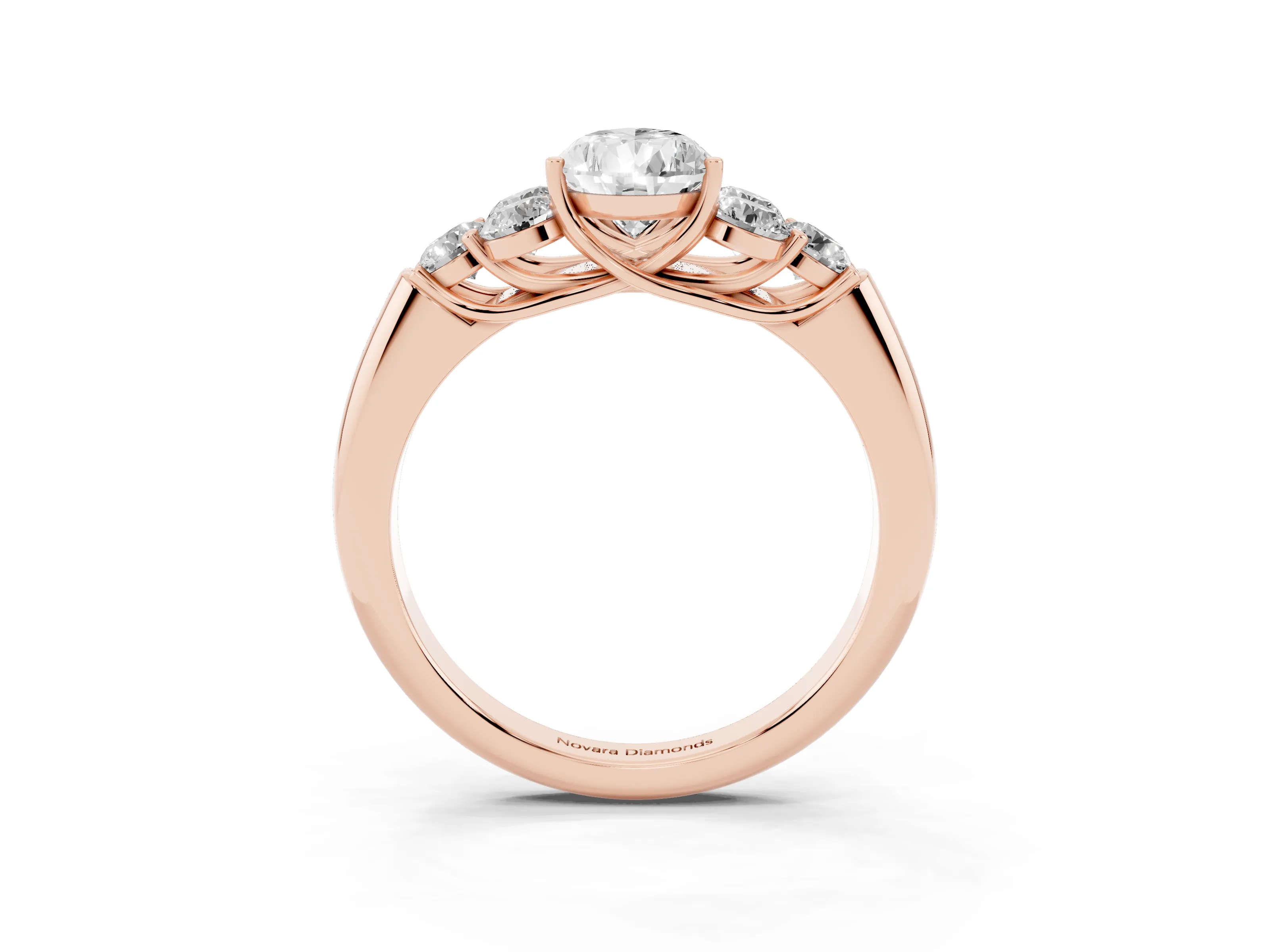 Pear Cut Diamond Cluster Ring Set in Rose gold with Round Accent Stones and Prong Setting on a Plain Band