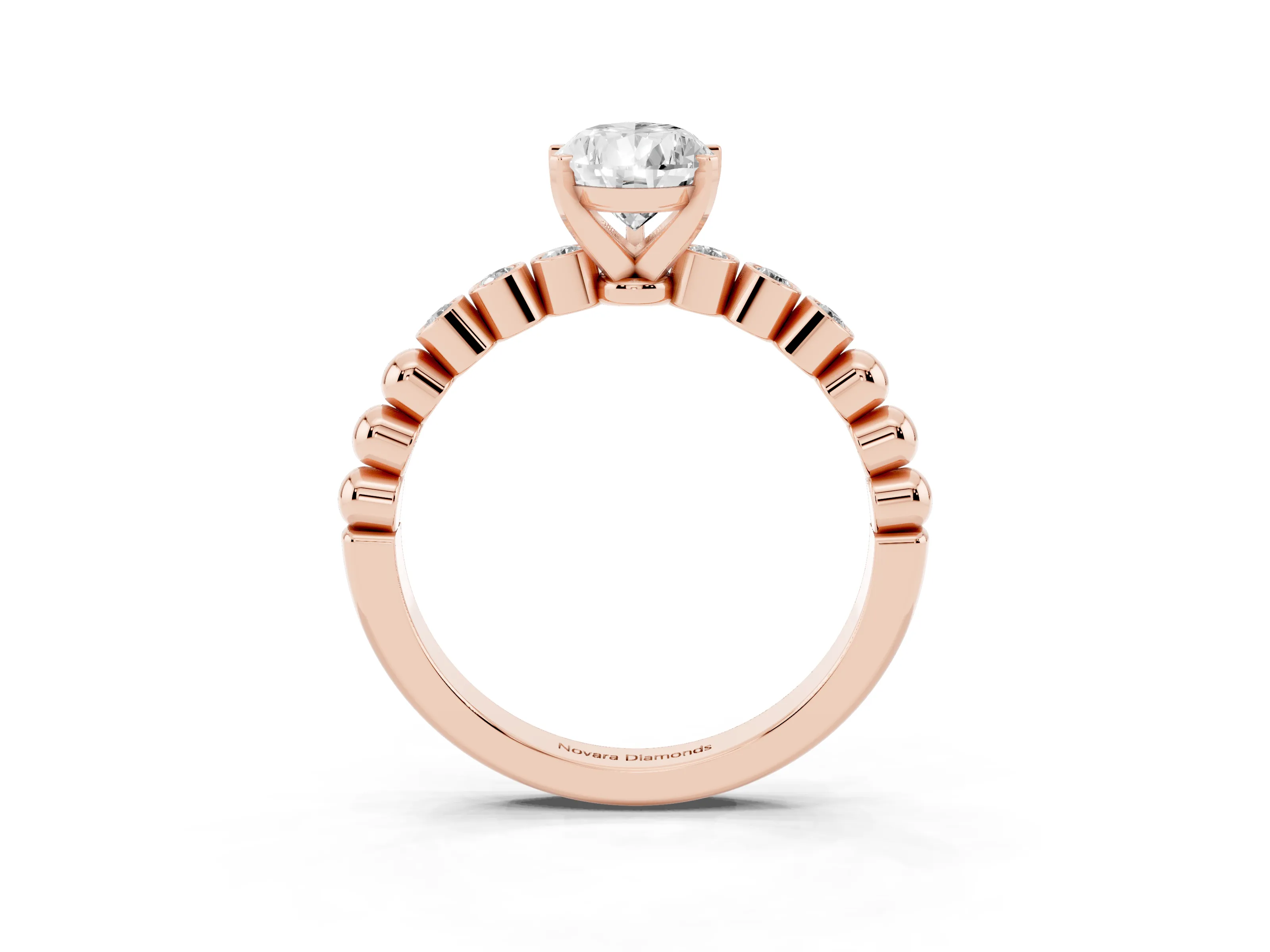 Pear Cut Diamond Solitaire Engagement Ring Set in Rose gold with Bezel Accents on Beaded Band