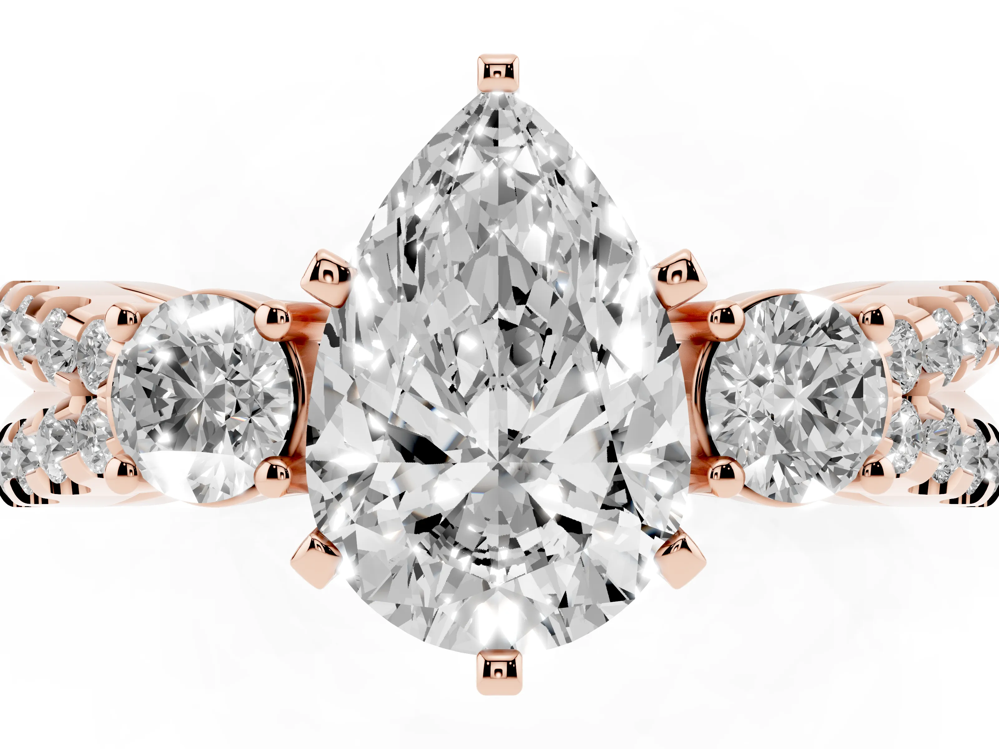 Pear Cut Diamond Three-Stone Ring Set in Rose gold with Pavé Split Shank and Prong Setting