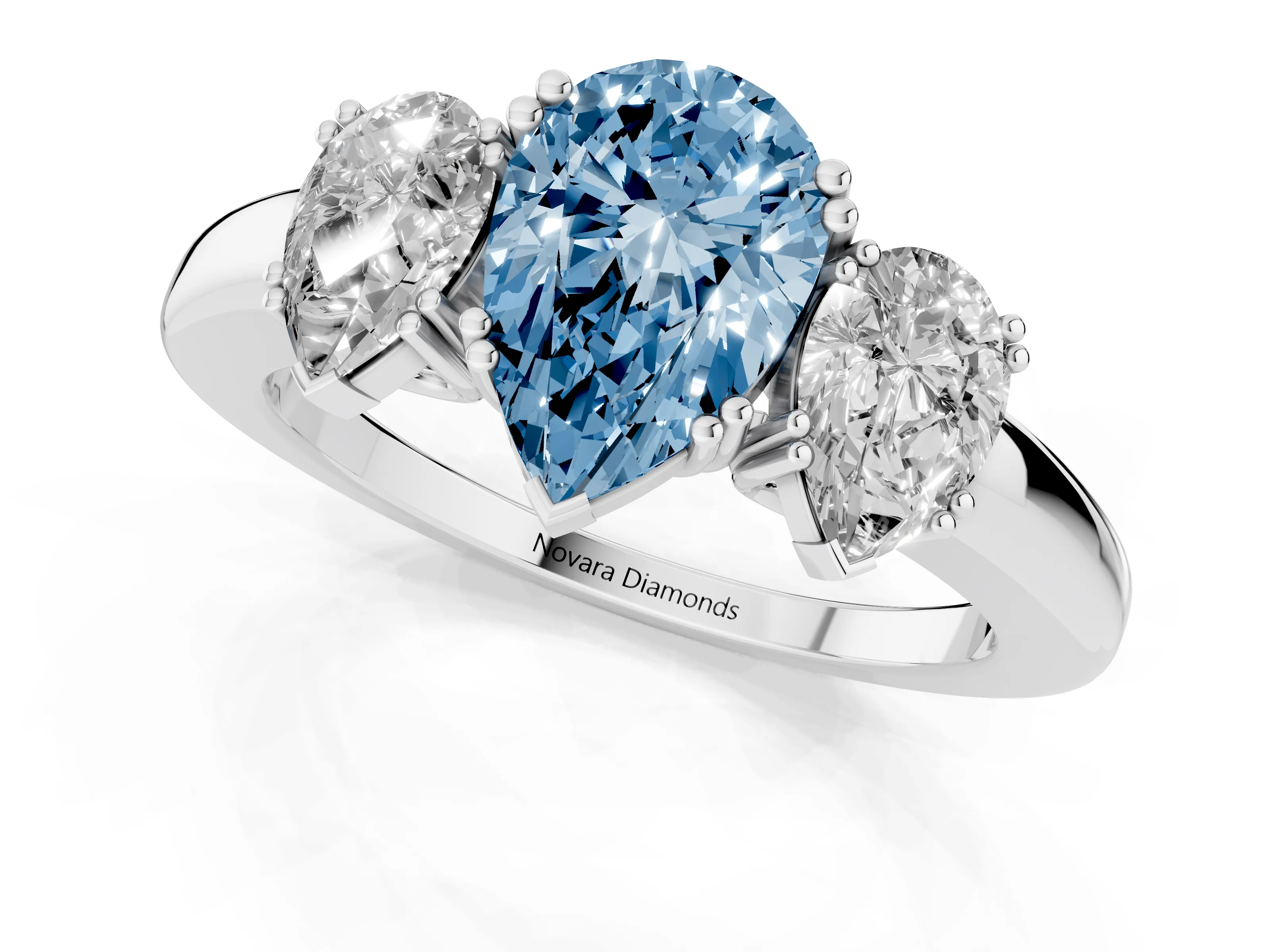 Fancy Blue Pear Cut Diamond Three-Stone Ring Set in White gold with Polished Channel-Set Band