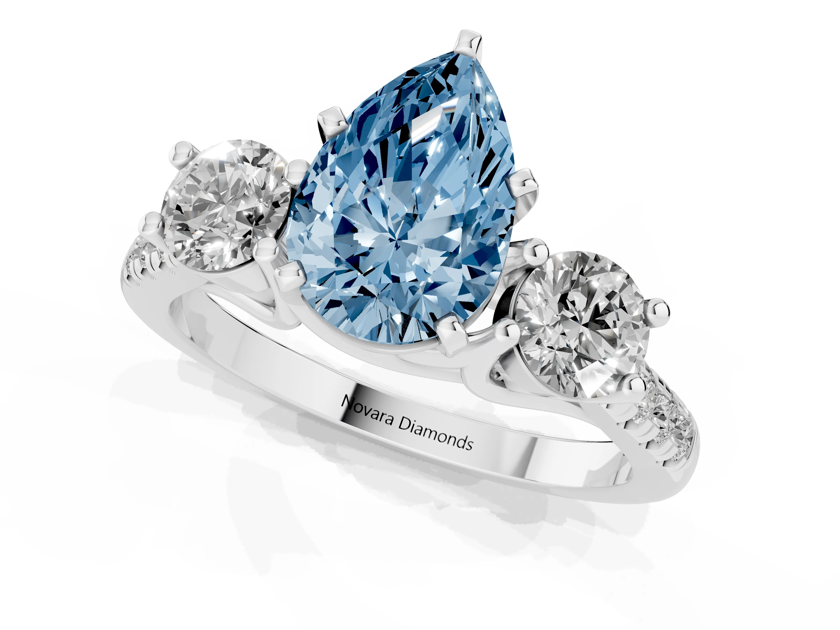 Fancy Blue Three-Stone Pear Cut Diamond Pavé Band Ring Set in Platinum with Prong-Set Trio