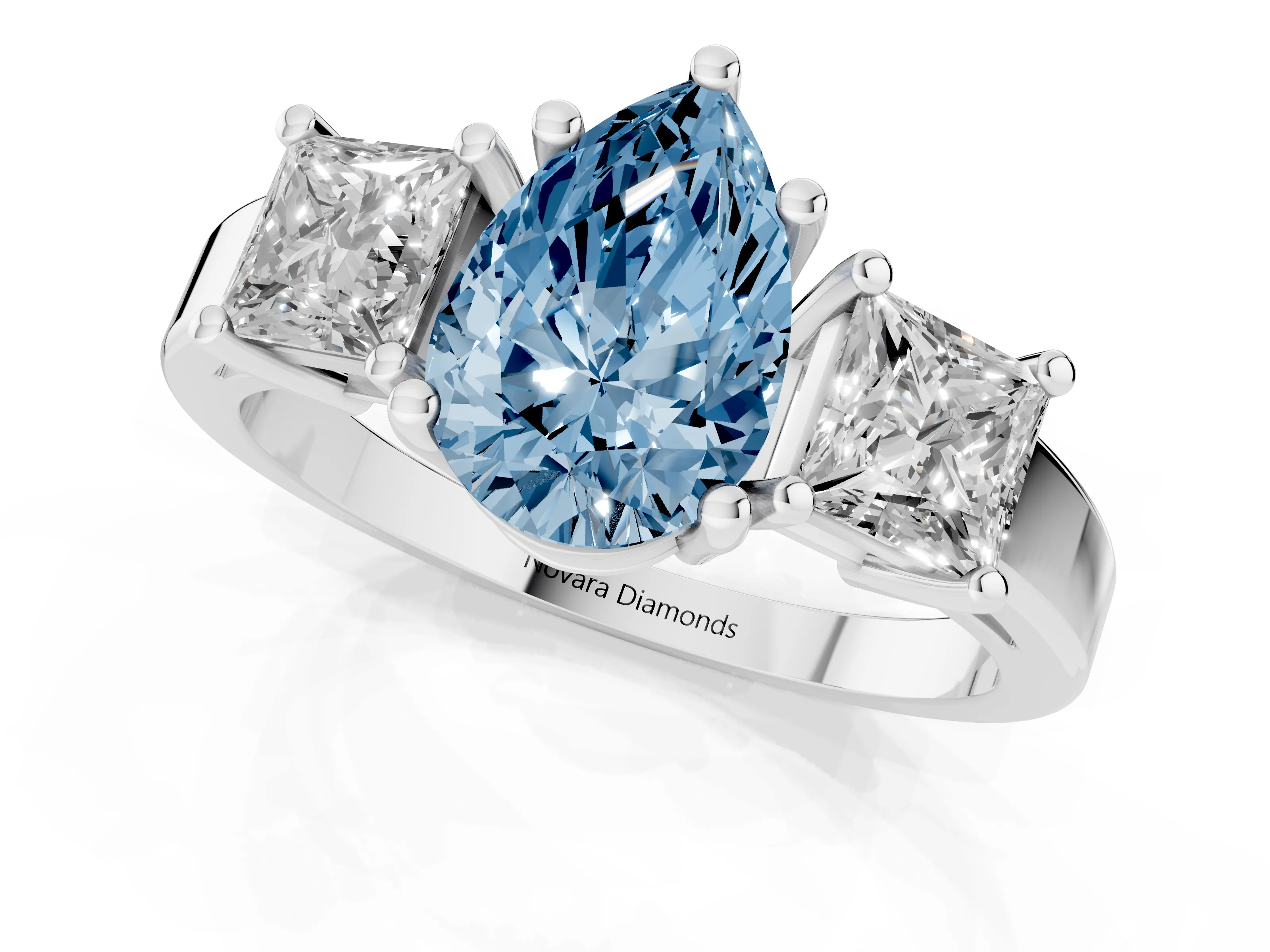 Fancy Blue Three-Stone Pear Cut Diamond Solitaire Ring Set in Platinum with Prong Setting