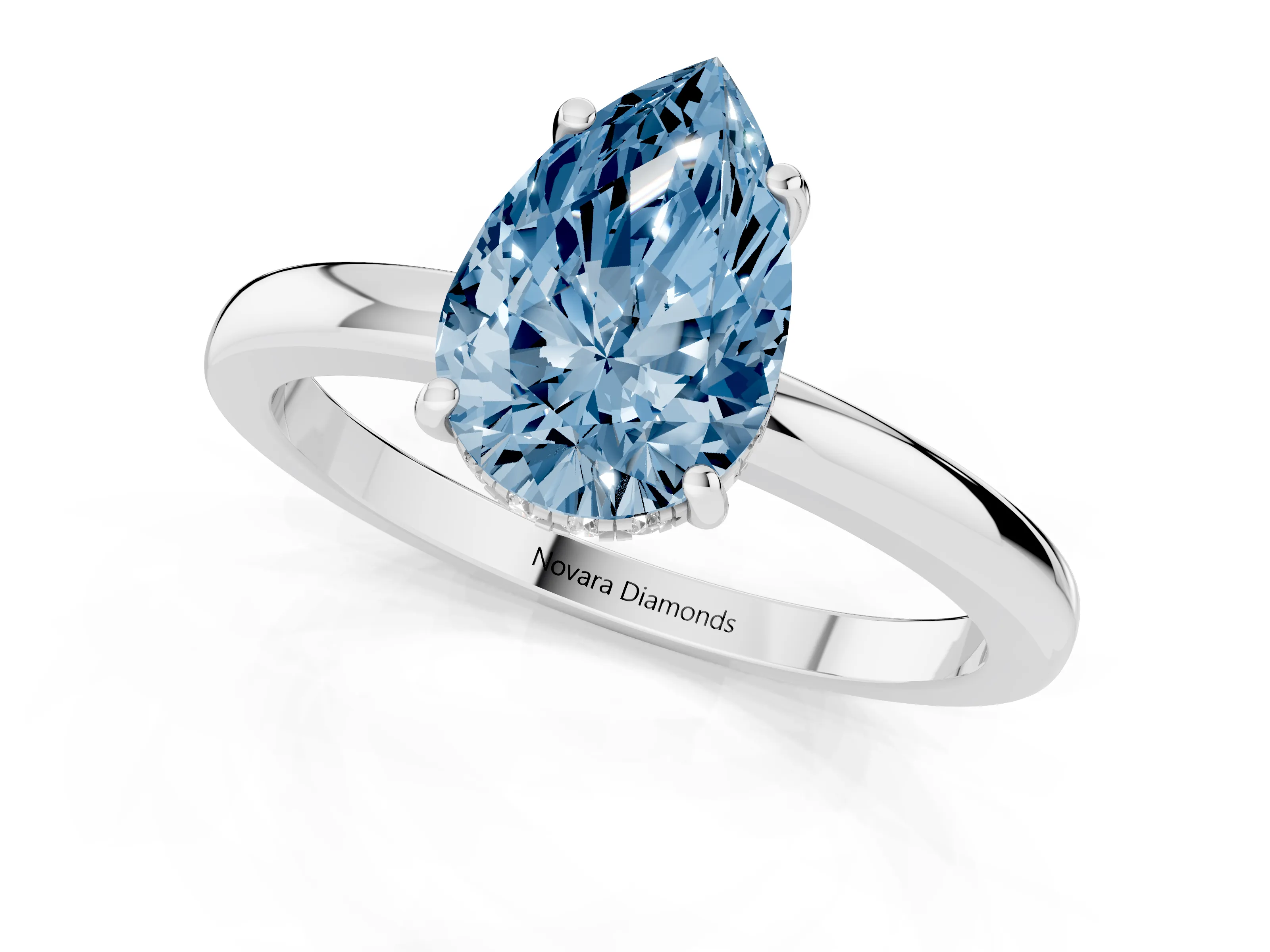 Fancy Blue Pear Cut Diamond Solitaire Ring Set in White gold with Plain Band and Prong Setting