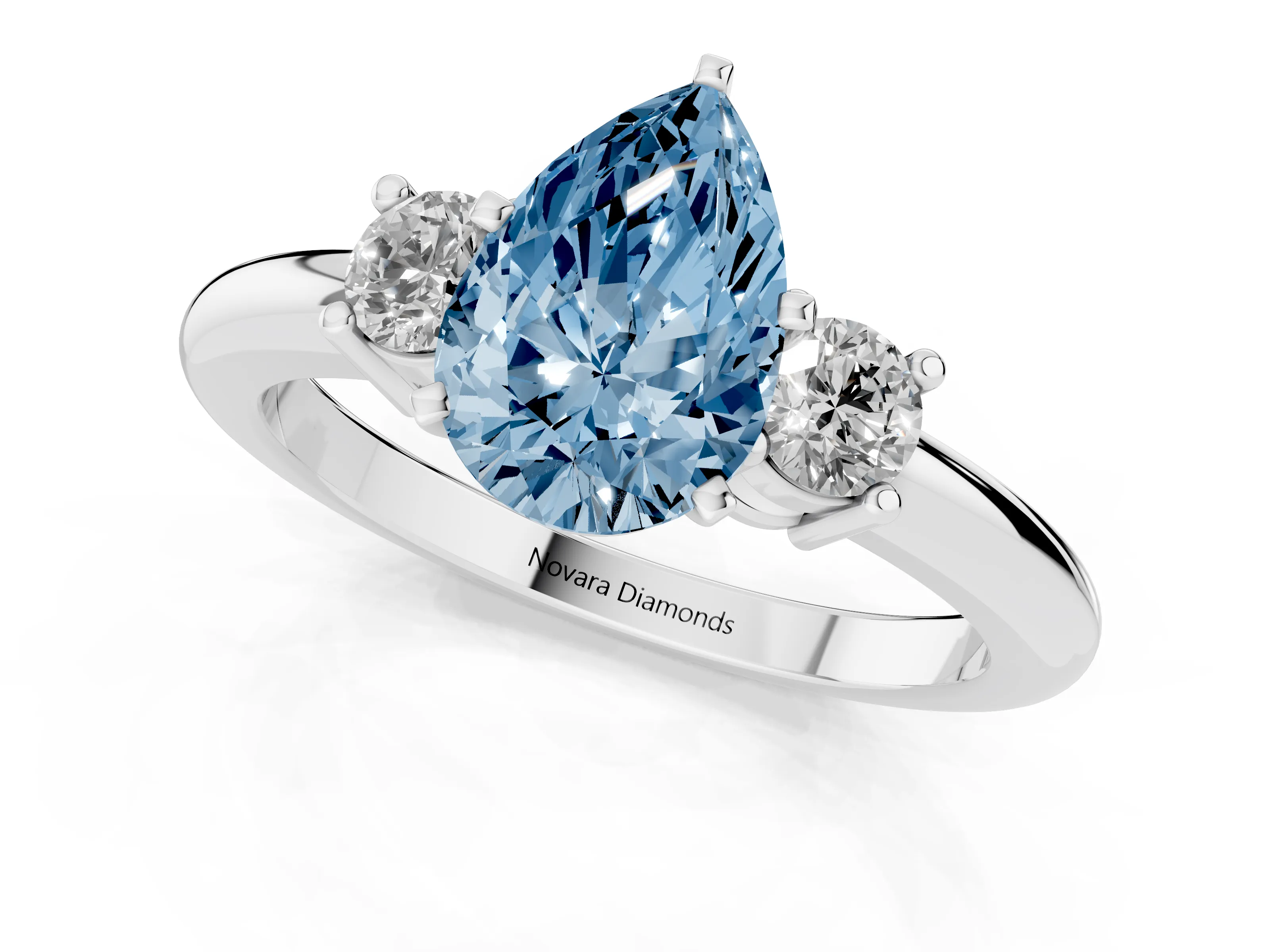 Fancy Blue Three-Stone Pear Cut Diamond Ring Set in Platinum with Prong Setting and Plain Band