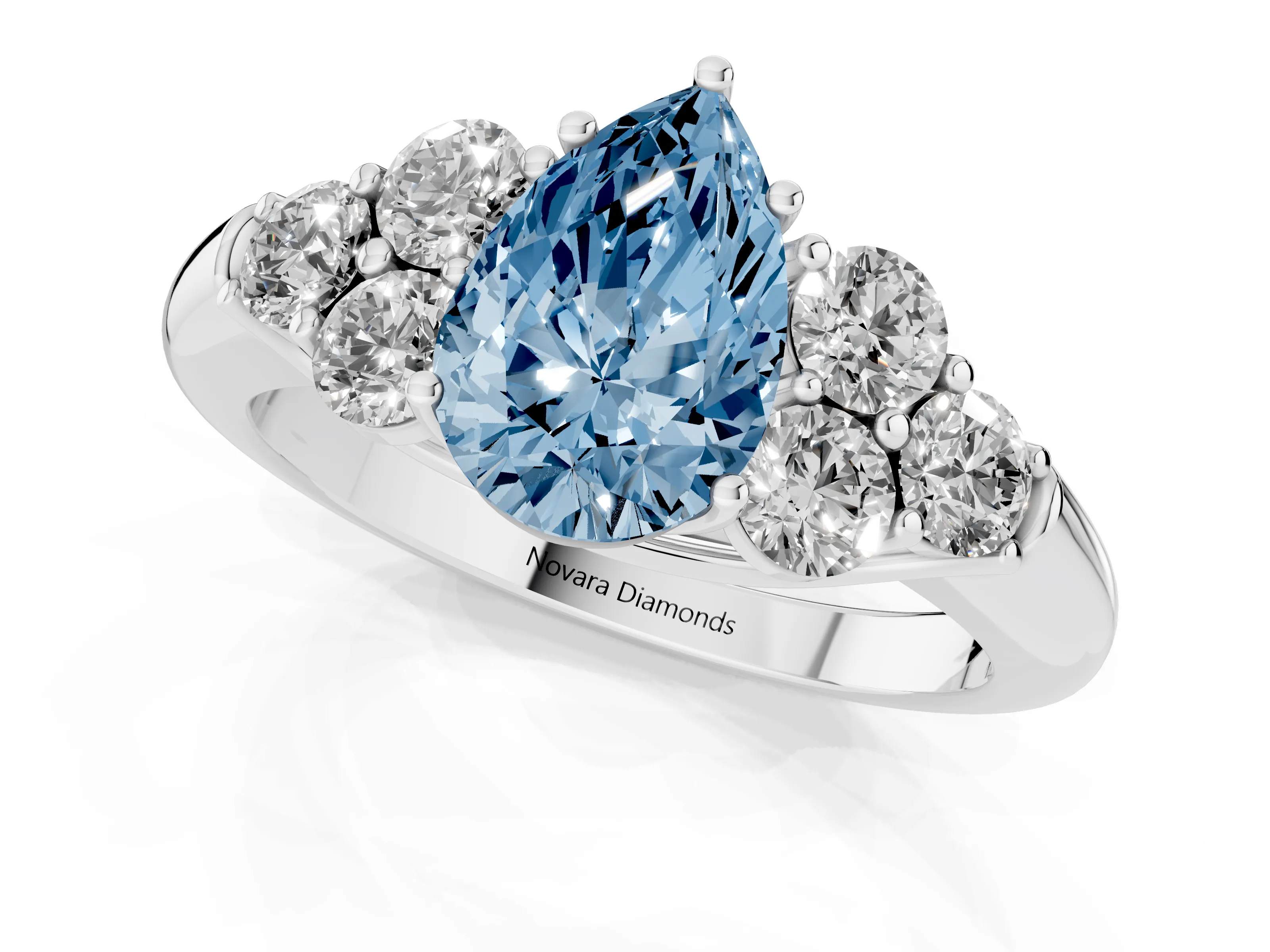 Fancy Blue Pear Cut Diamond Cluster Ring Set in Platinum with Round Accent Stones and Prong Setting on a Plain Band