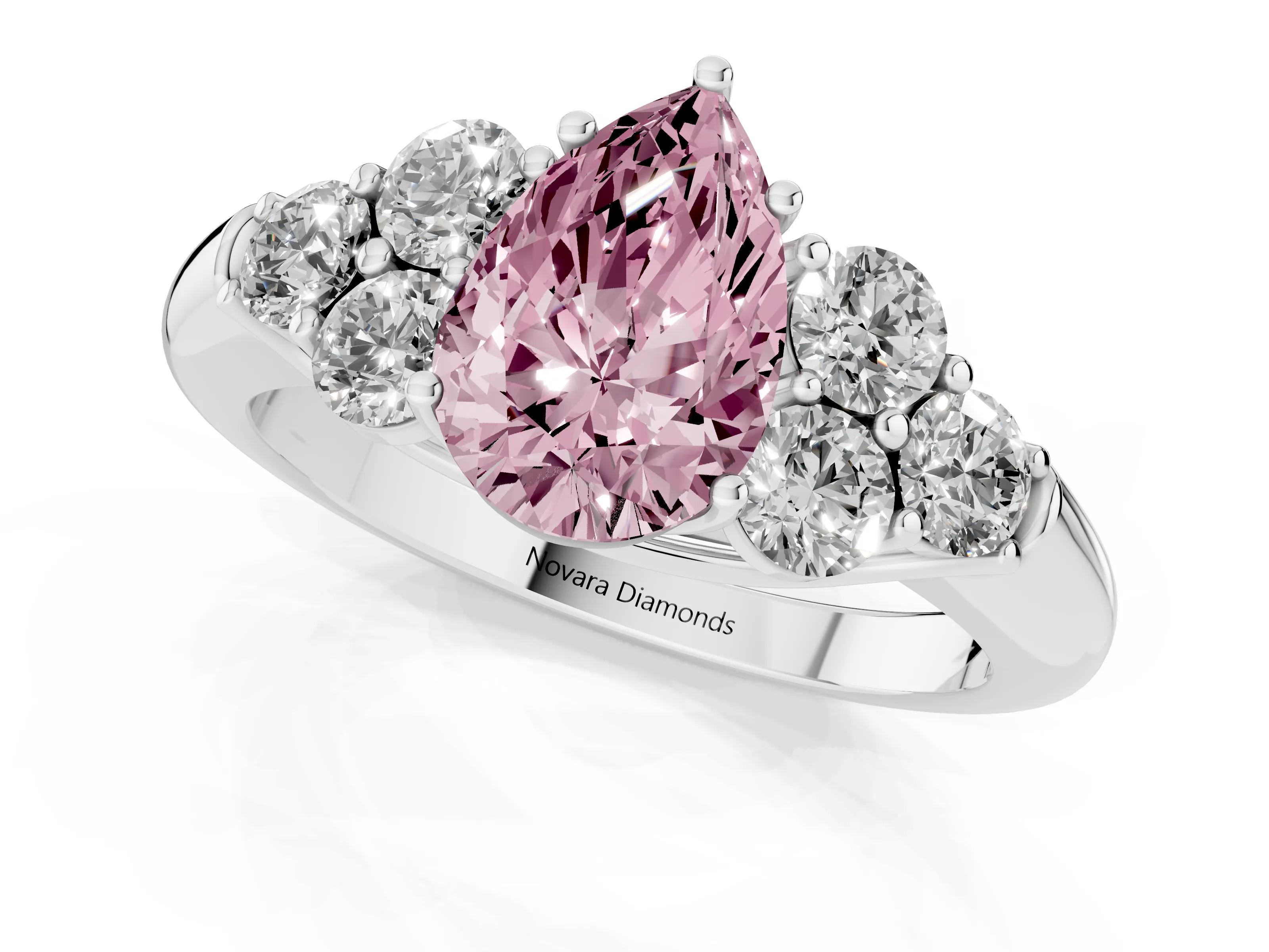 Fancy Pink Pear Cut Diamond Cluster Ring Set in Silver with Round Accent Stones and Prong Setting on a Plain Band